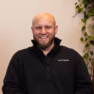 Professional headshot of Blaize, Activate team member, with approachable smile
