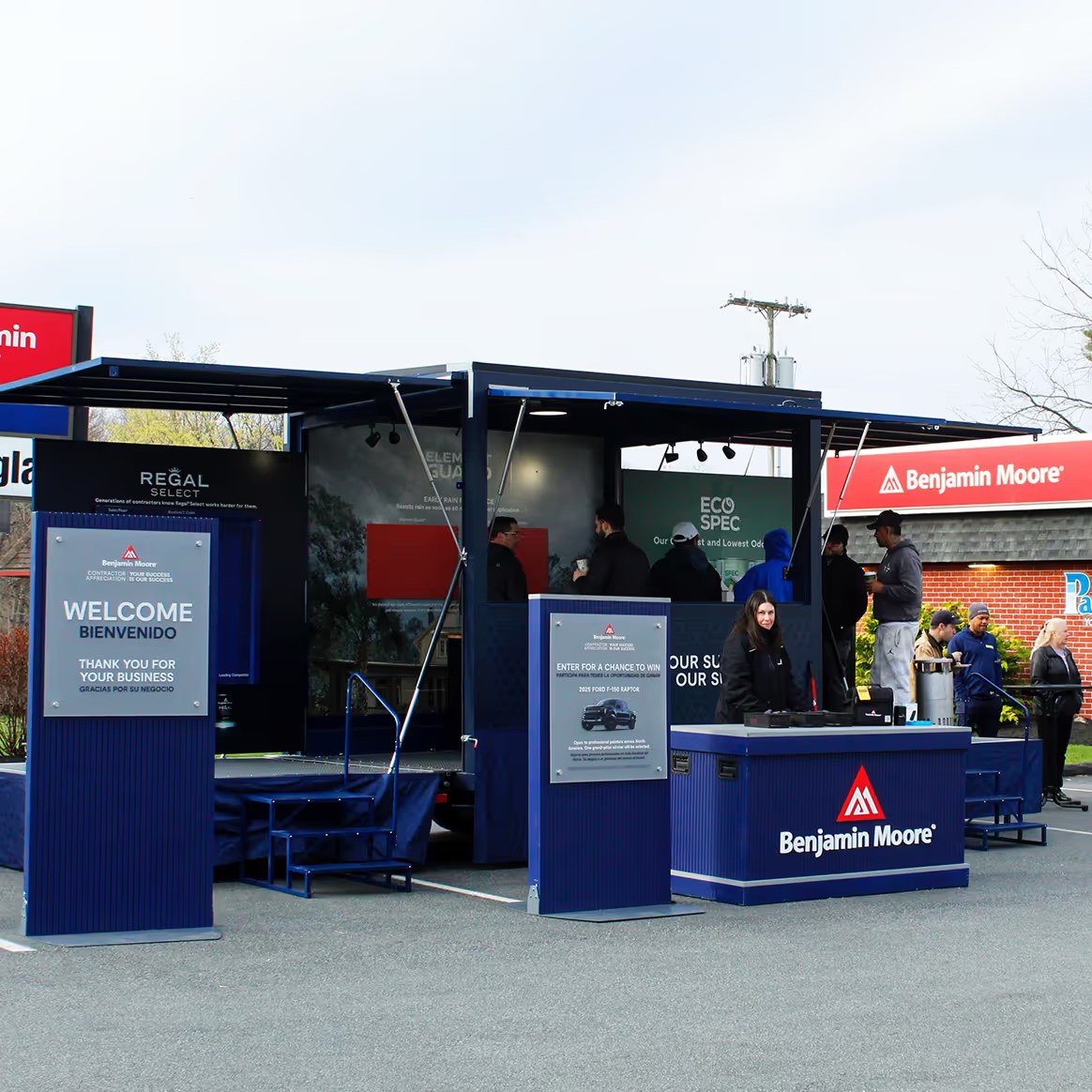 Benjamin Moore Contractor Appreciation Tour trailer with branded welcome signage and product displays