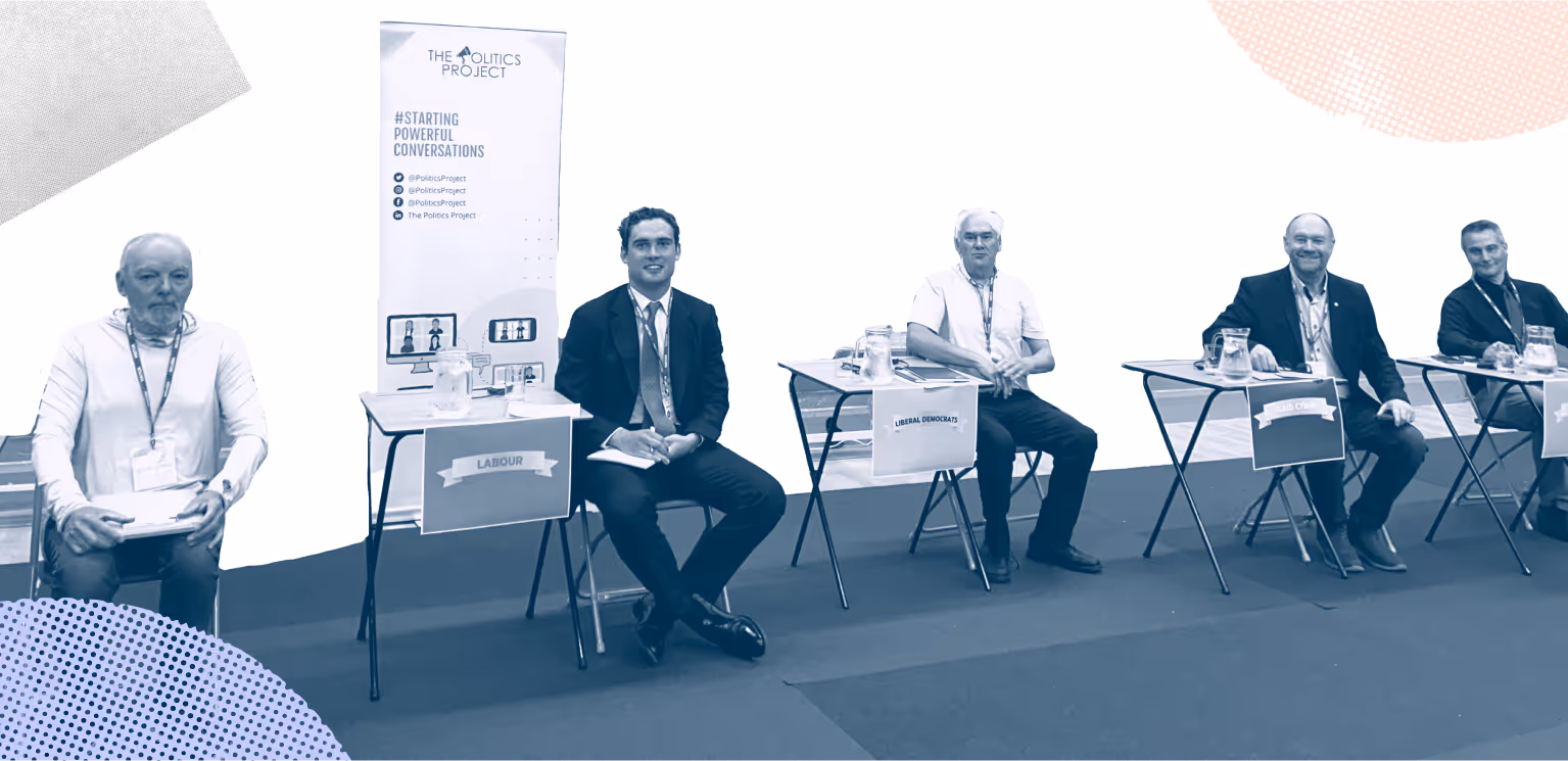General Election candidates and party representatives sat next to their party poster, ready for the Mid and South Pembrokeshire Youth Hustings.