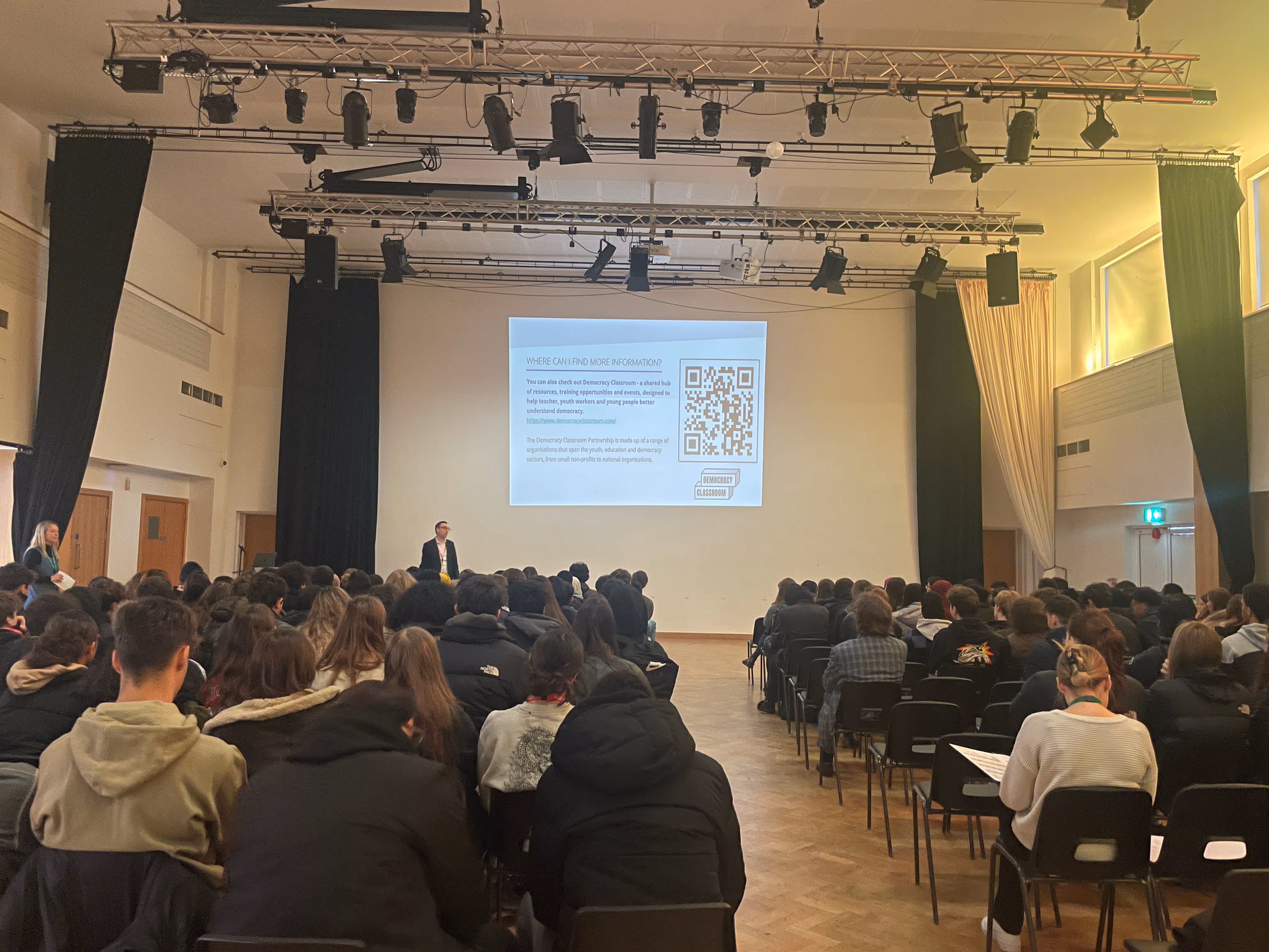 An 'Exploring Elections' Assembly, delivered by TPP, with learners at Queens Park Community School.