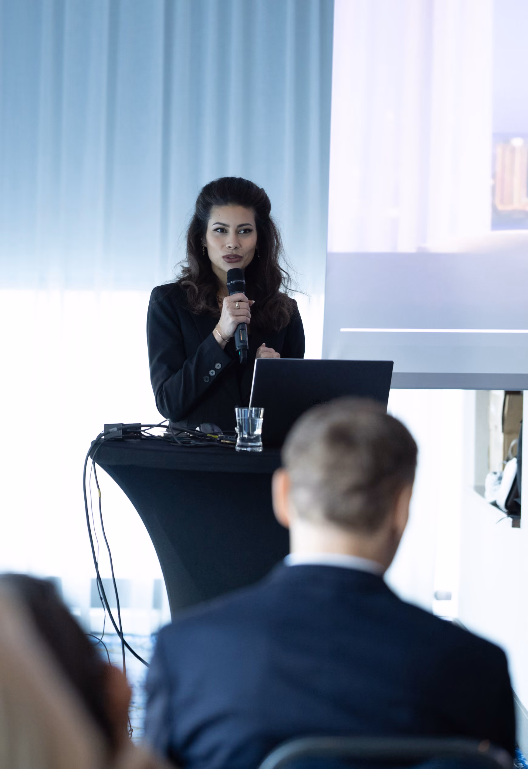 Baraca Capital speaker presenting at a Dubai investment event.