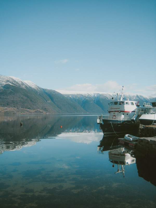 Boats on a pier in a fjord in Norway