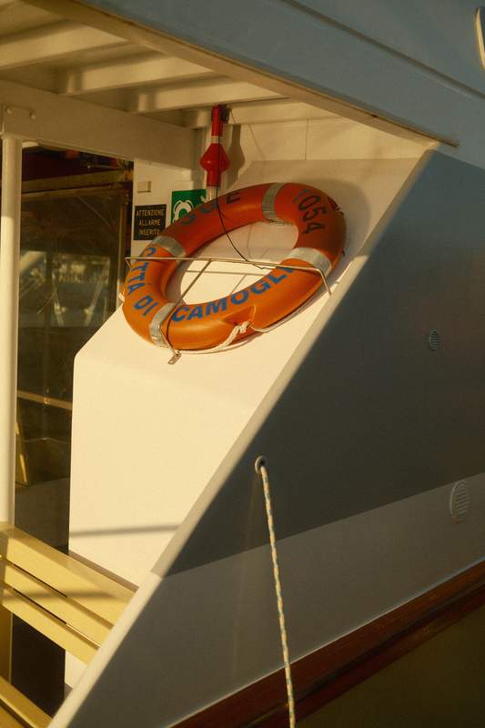 a lifejacket on a boat on a sunset light in liguria