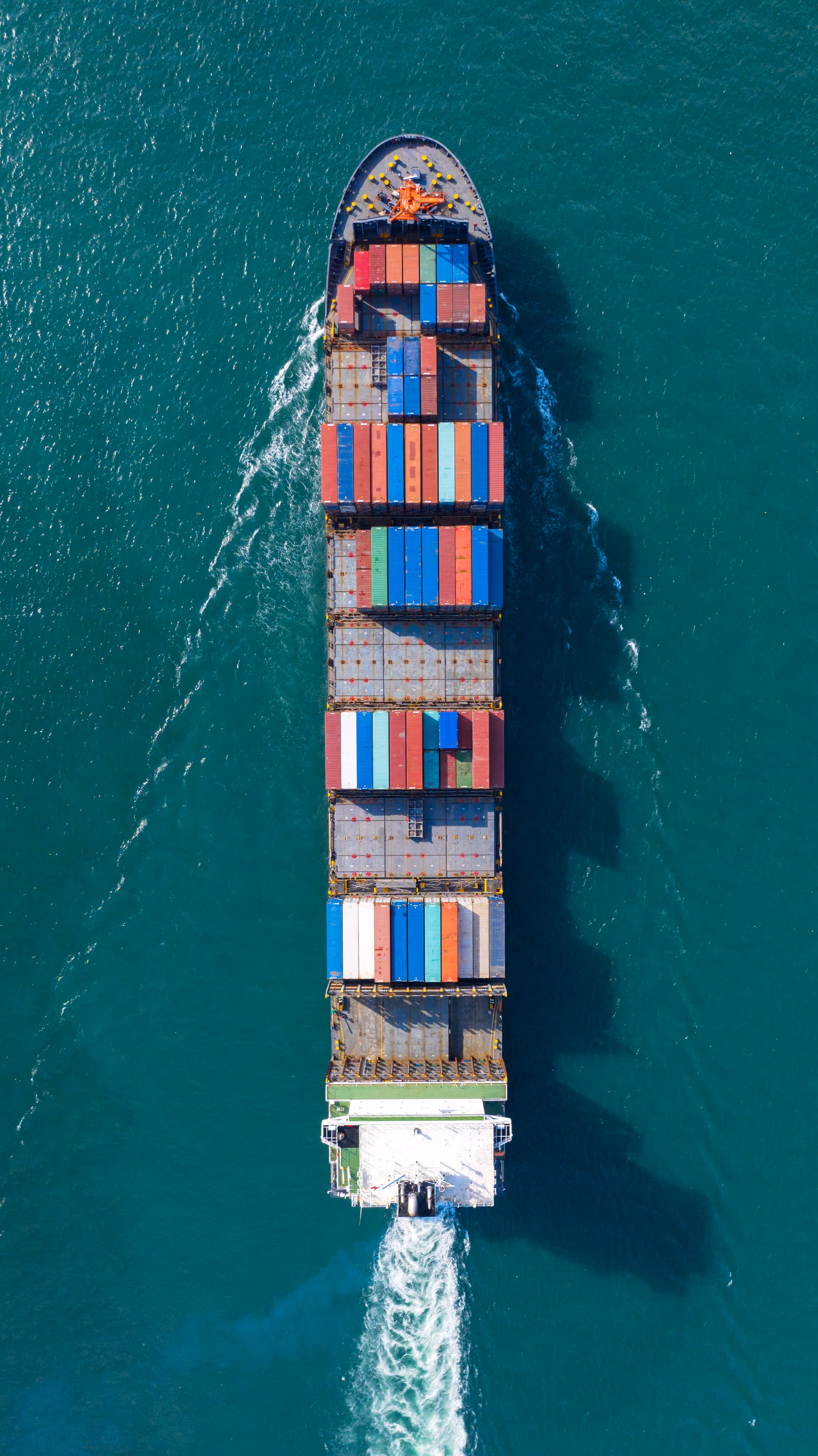 Aerial view of a shipping container sailing 