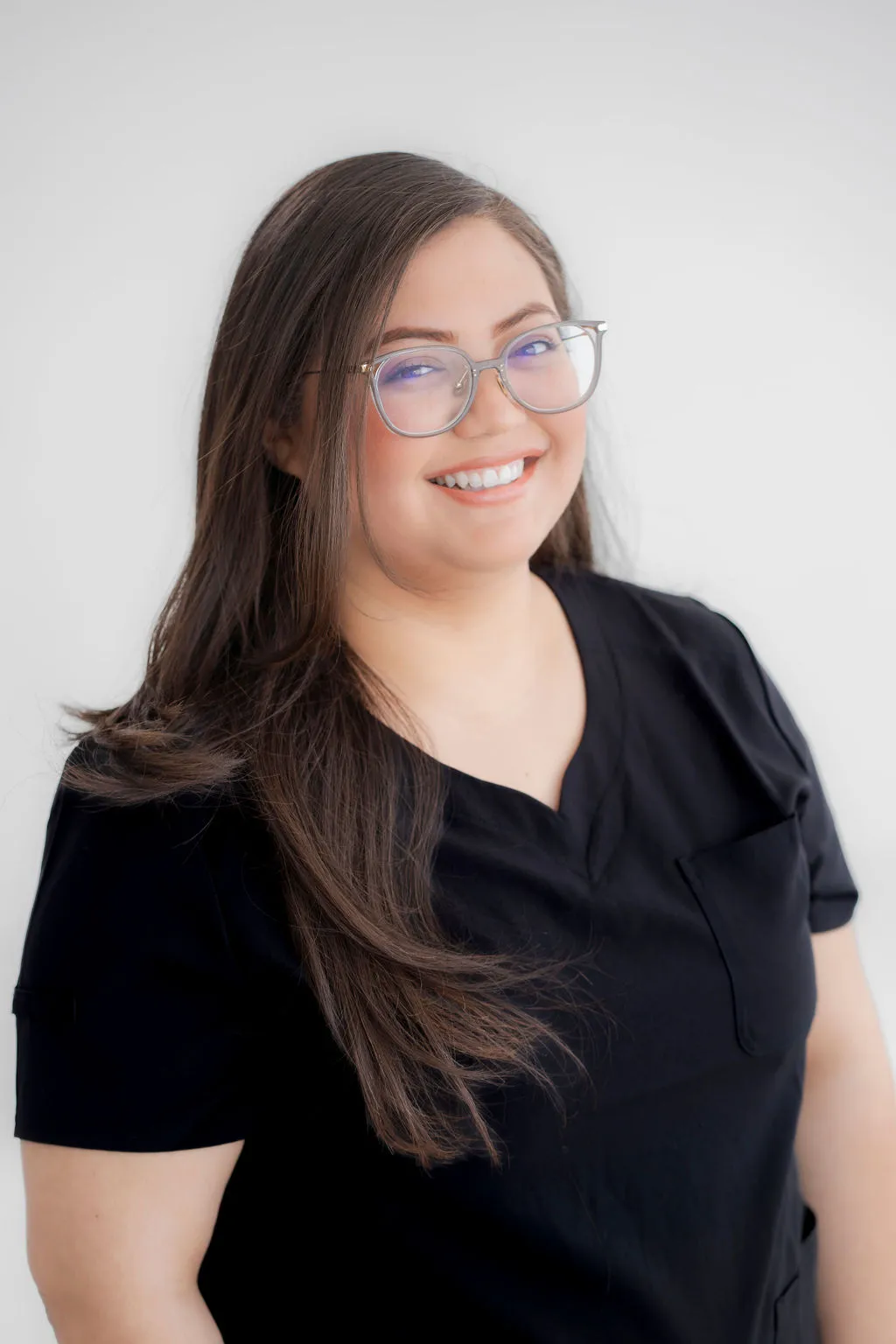 Headshot of a professional team member at Texas Dizziness Center, smiling confidently.