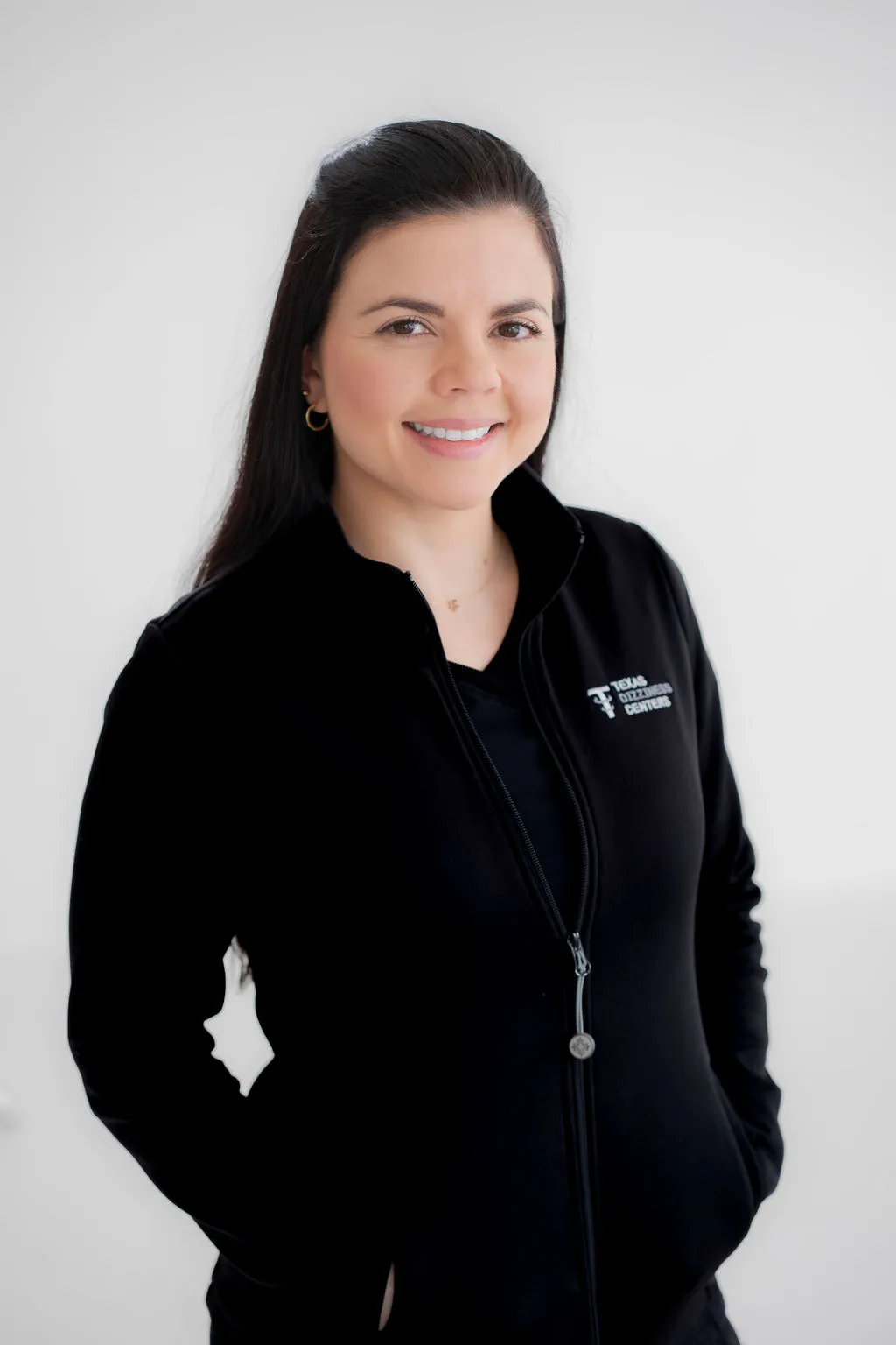 Headshot of a professional team member at Texas Dizziness Center, smiling confidently.