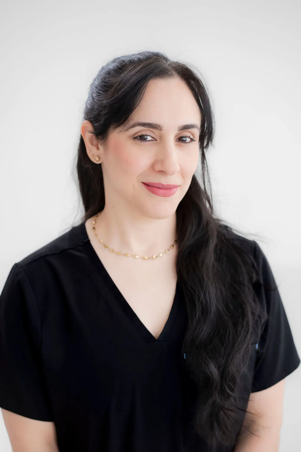 Headshot of a professional team member at Texas Dizziness Center, smiling confidently.
