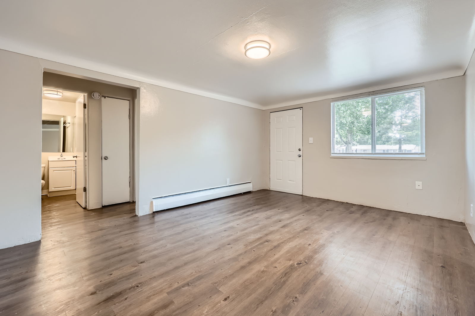 living and dining area with view of kitchen