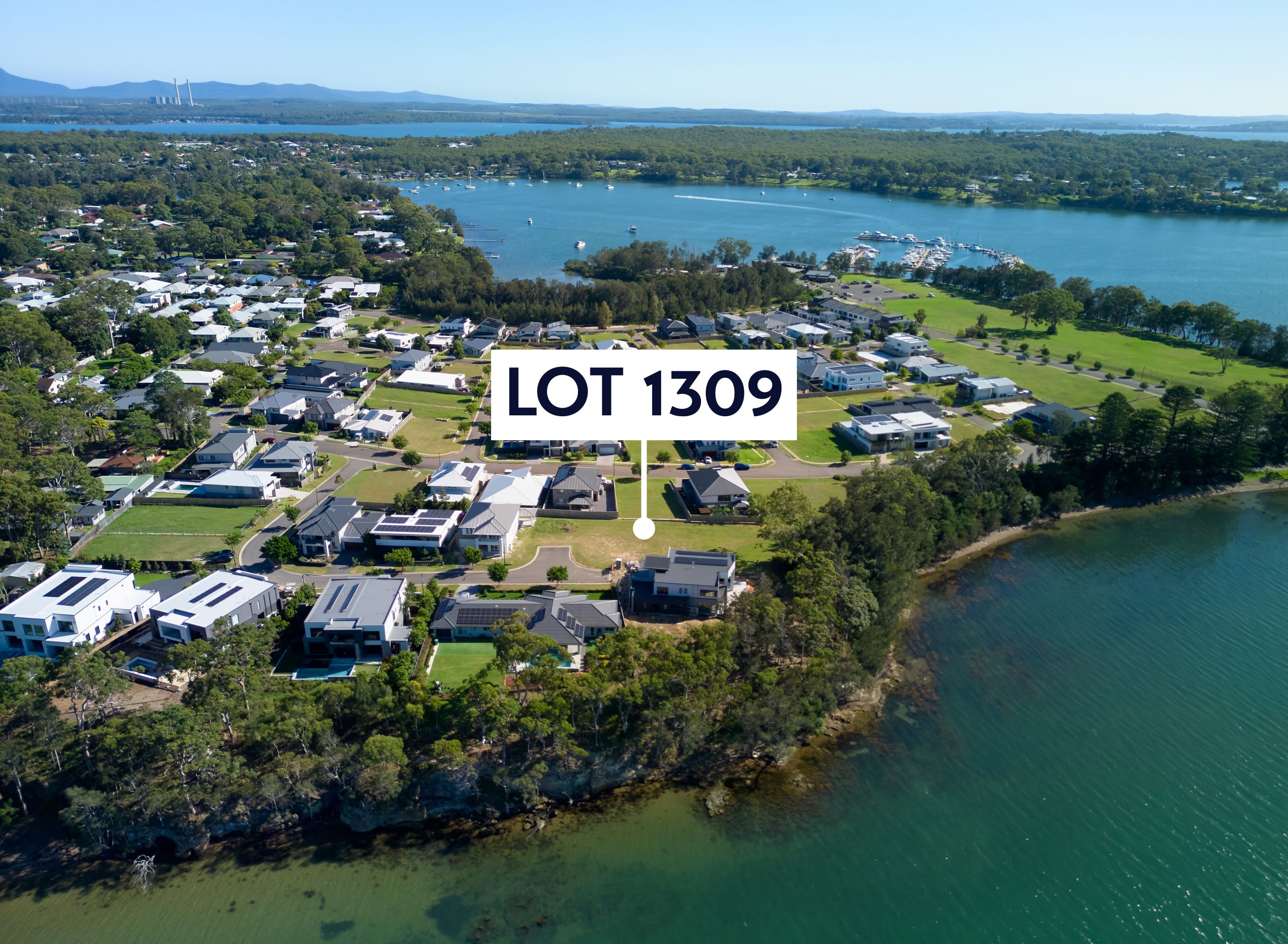  Aerial with a marker pointing at lot 1309. The aerial shows the lot is near the water. The Aerial shows the lot is on the lake's peninsula.