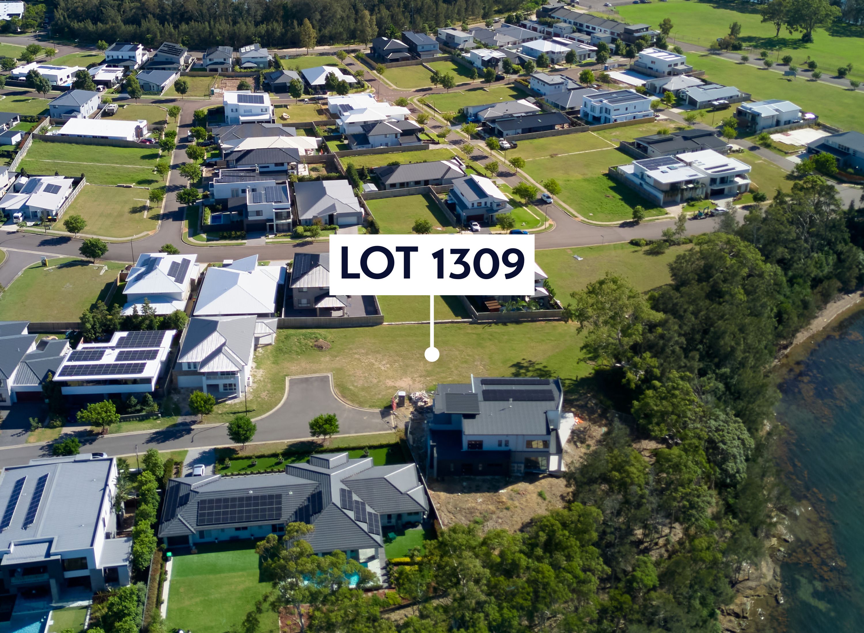 Aerial with a marker pointing at lot 1309. The aerial shows the lot is near the water