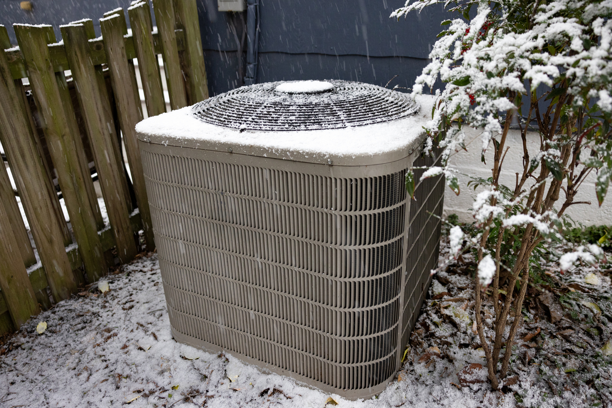 Snow-Covered Outdoor Heat Pump Unit