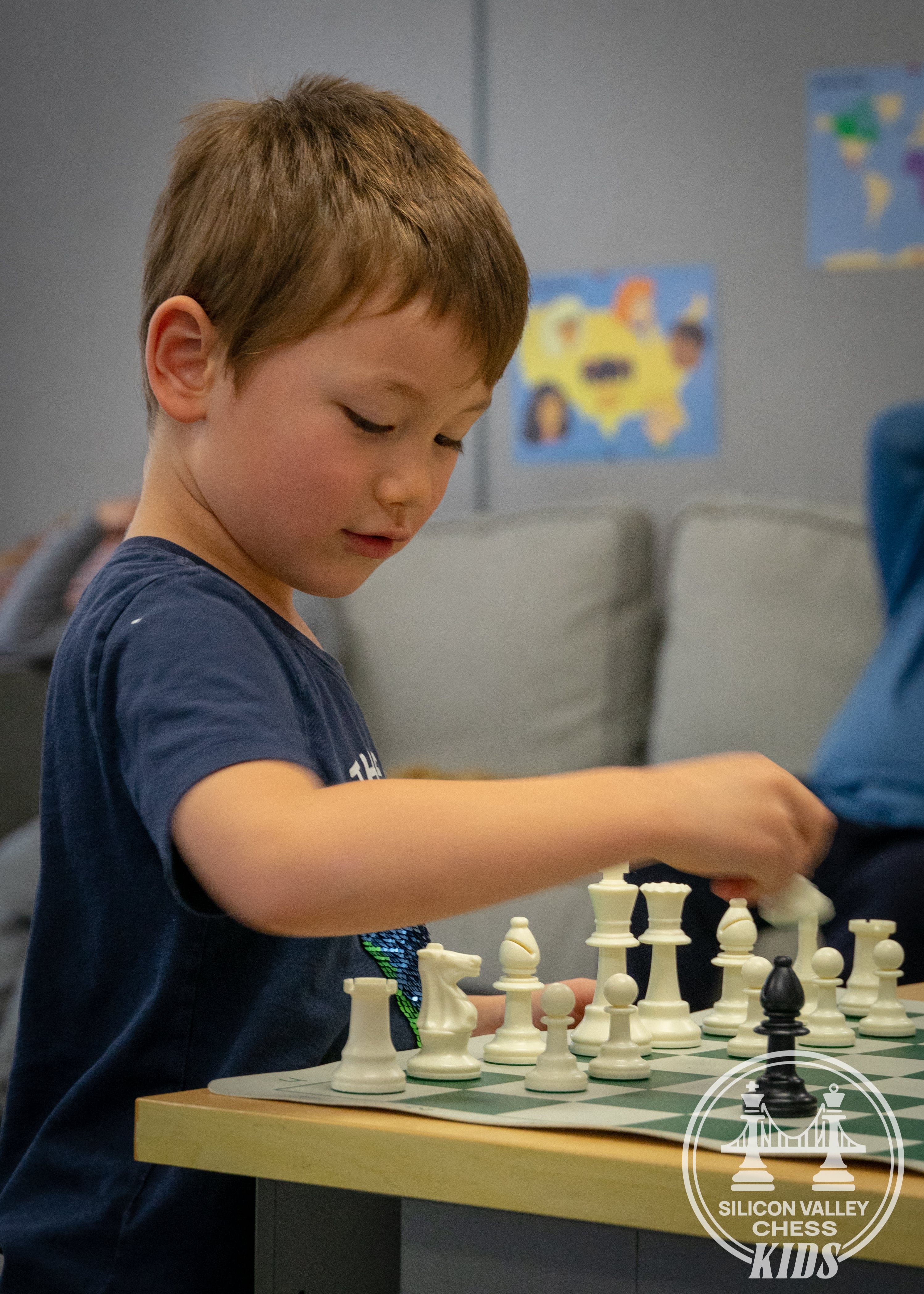 Children playing chess at SVC Kids Cupertino Sunday class with natural light setting