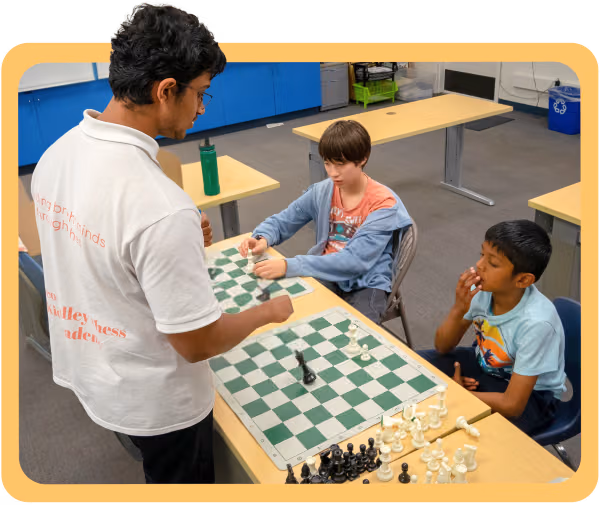 Coach Aryan teaching students in in-person classes at Silicon Valley Chess Academy's campus.