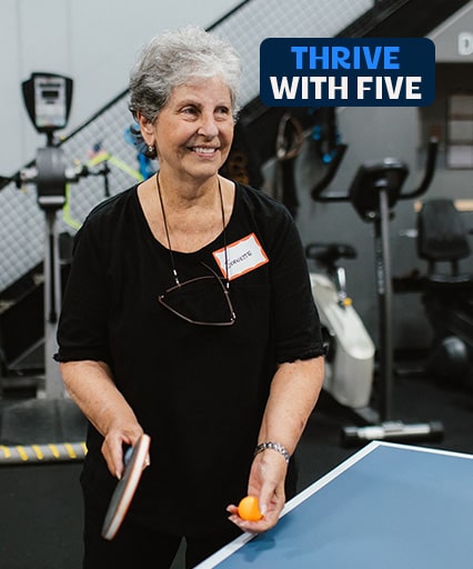Woman playing pong at Thrive with Five 2025