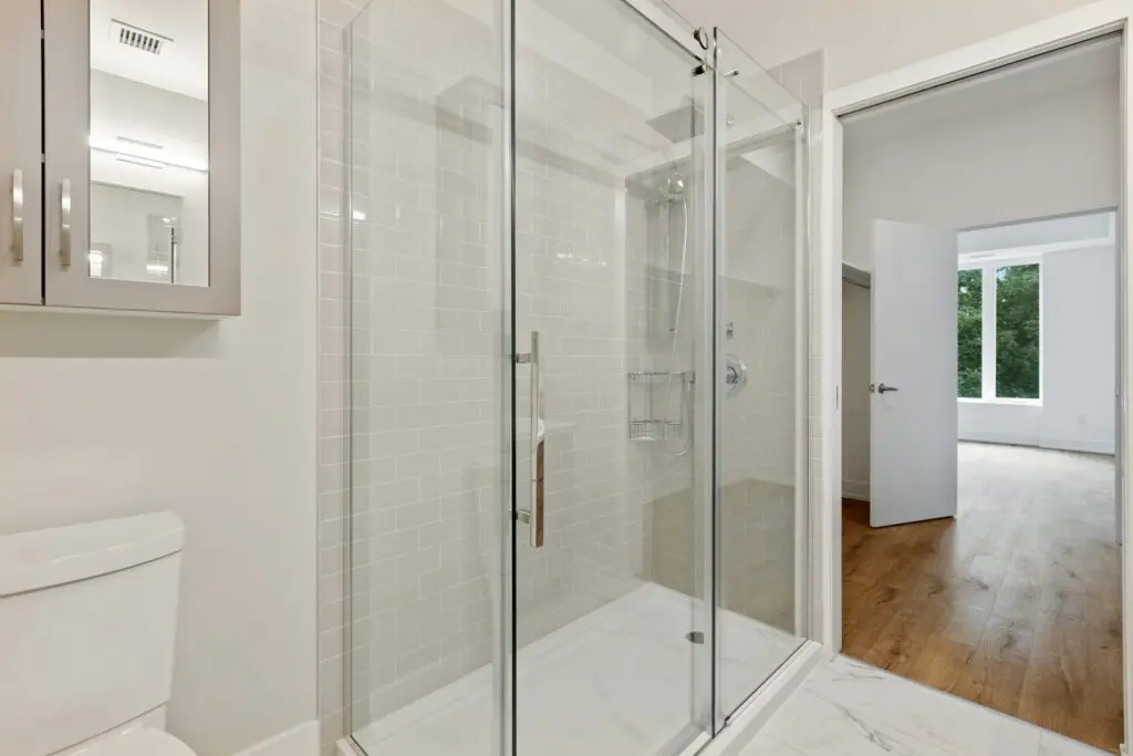 Why Shower Glass Doors Get Cloudy and How Surface Treatment Helps in New York