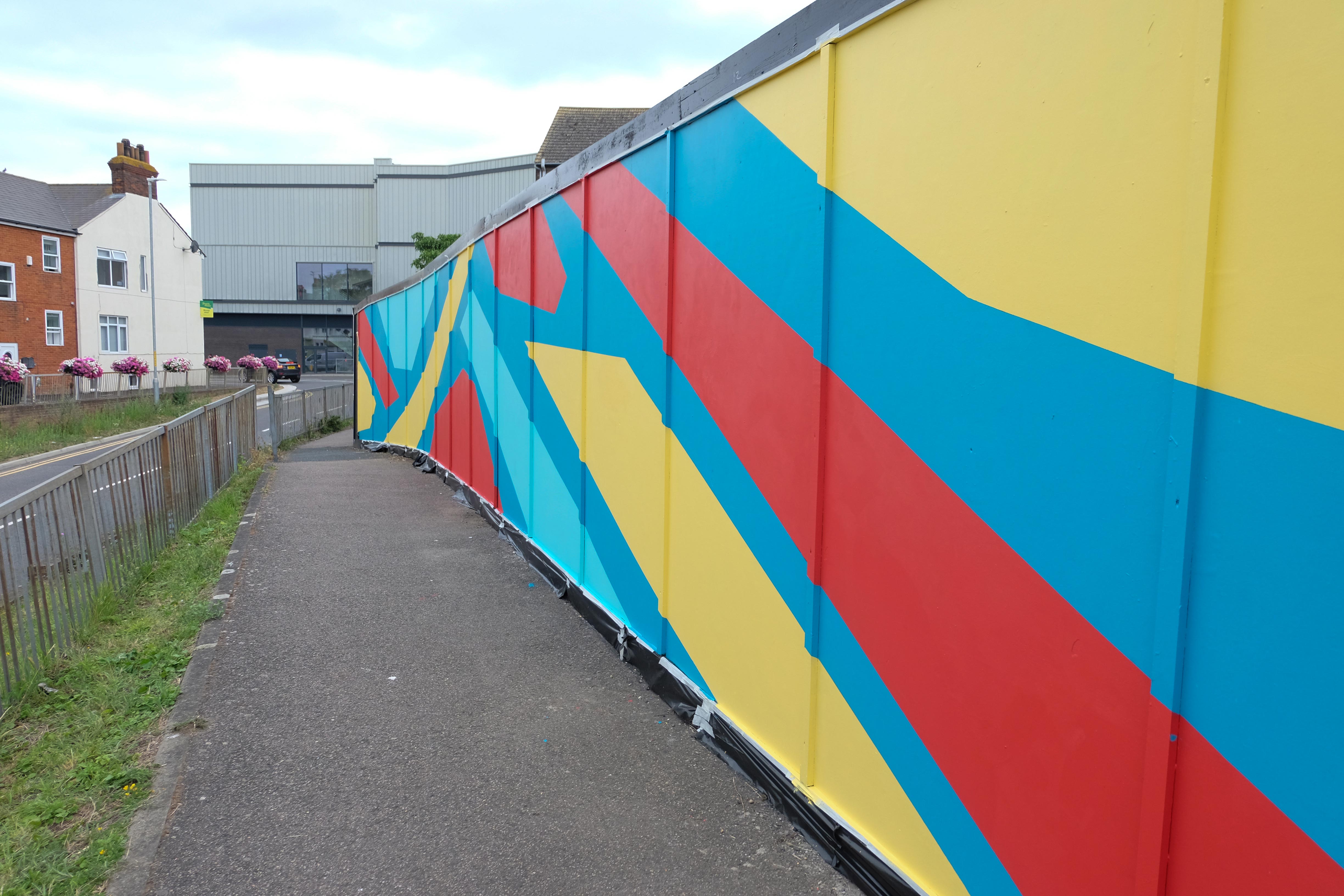 Close-up of mural design elements featuring local cultural motifs from Sittingbourne