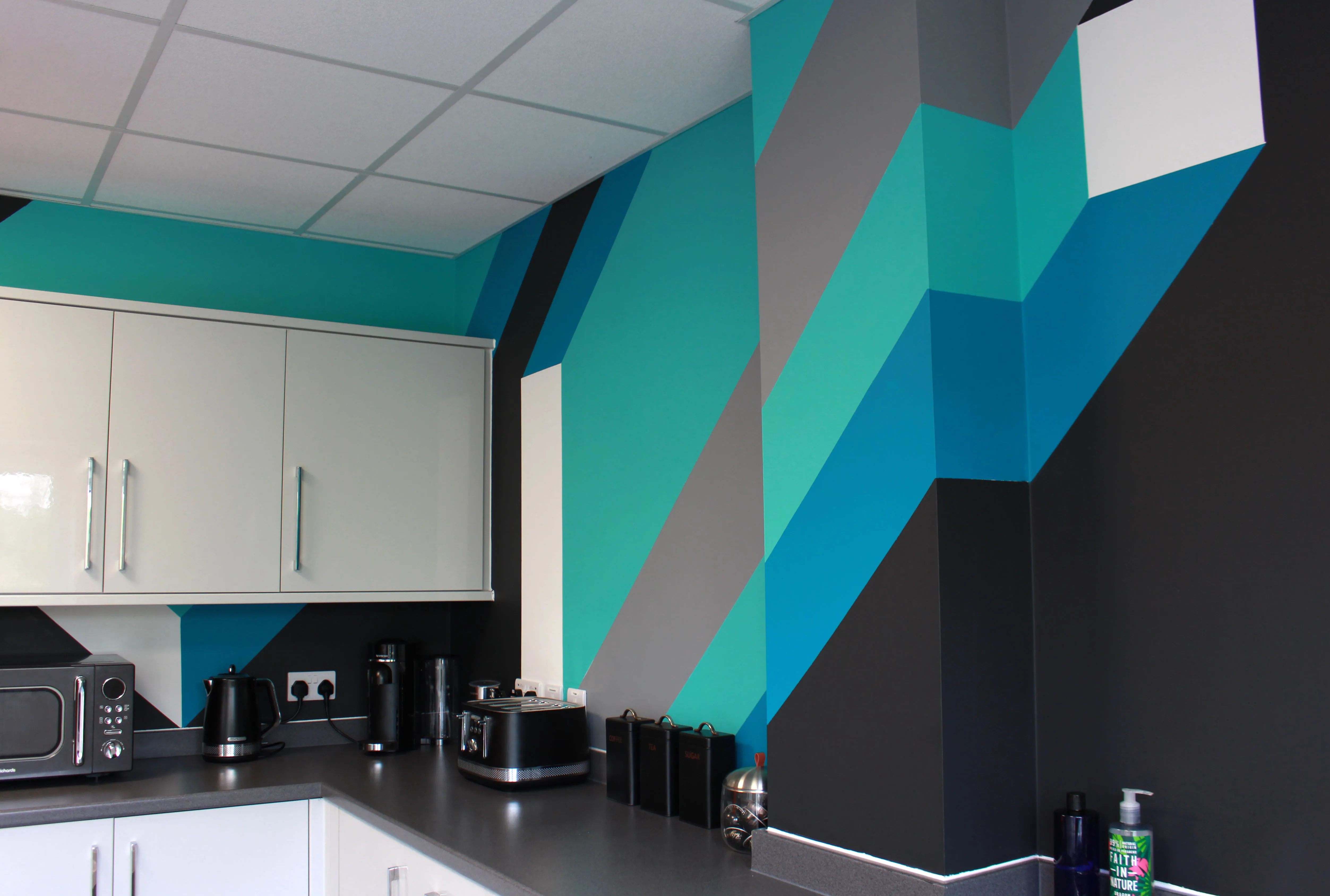 Final view of the hand-painted mural installed in FORTH's office, enhancing the workspace with dynamic visuals.