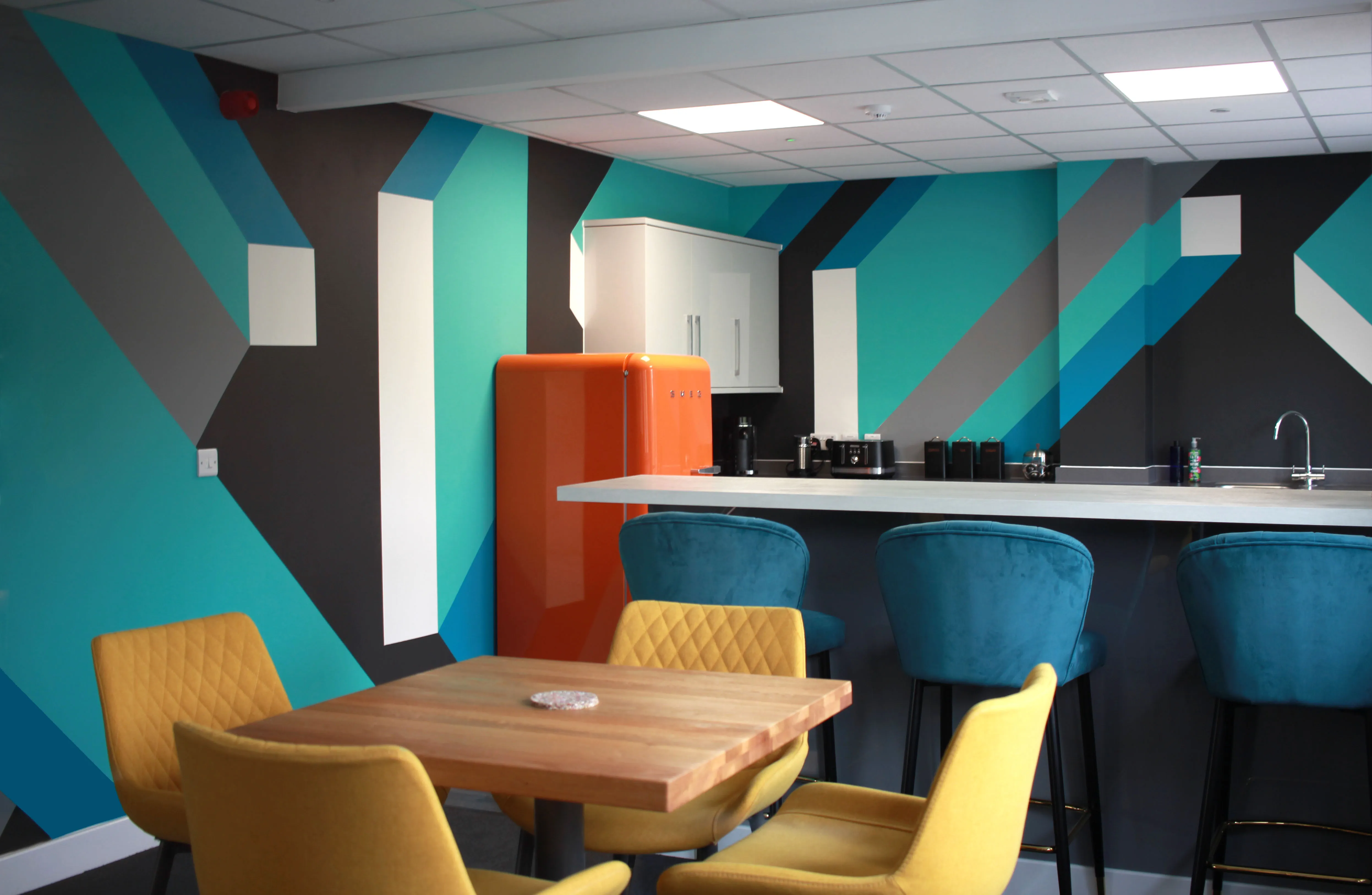 Final view of the hand-painted mural installed in FORTH's office, enhancing the workspace with dynamic visuals.