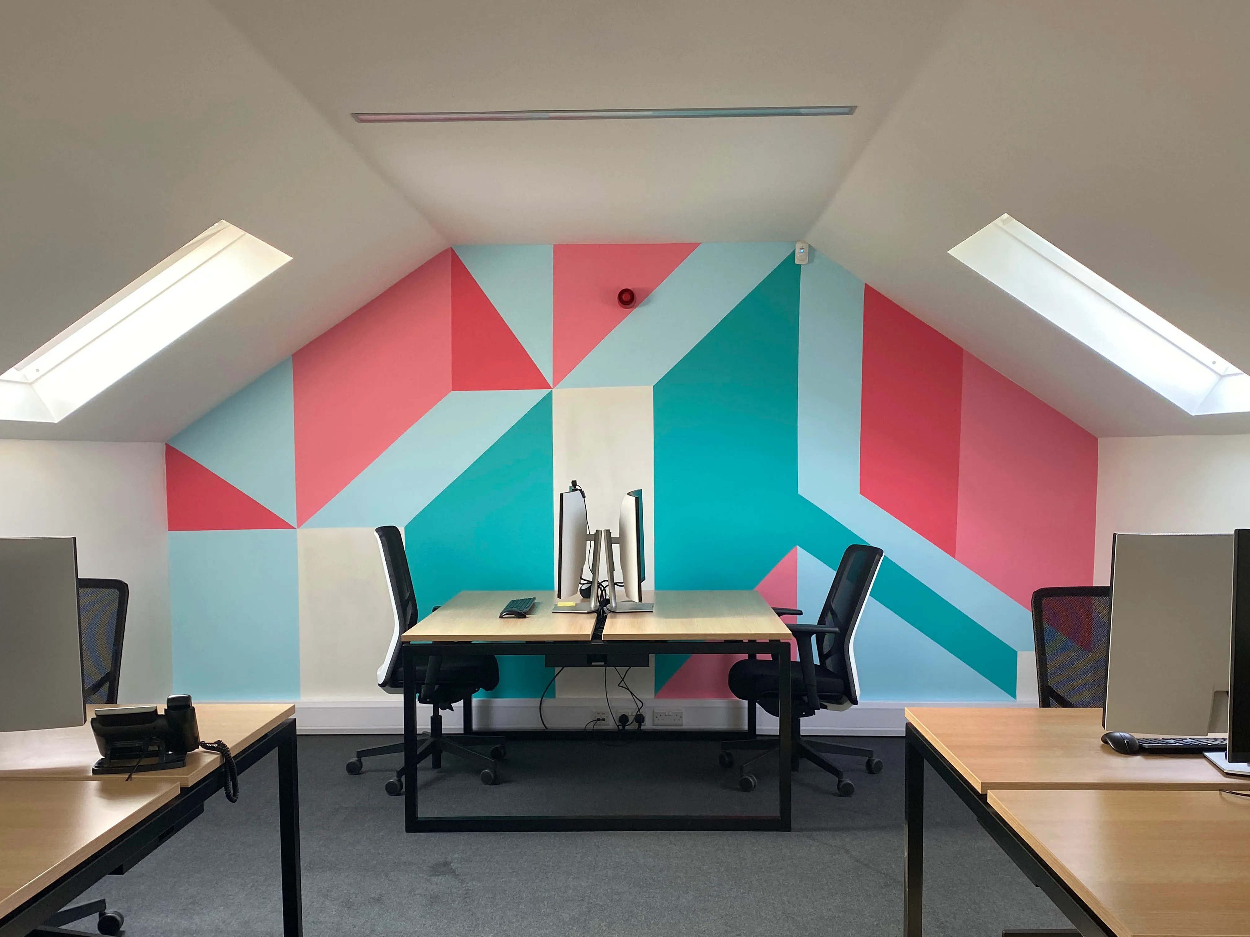 Final view of the hand-painted mural installed in FORTH's office, enhancing the workspace with dynamic visuals.