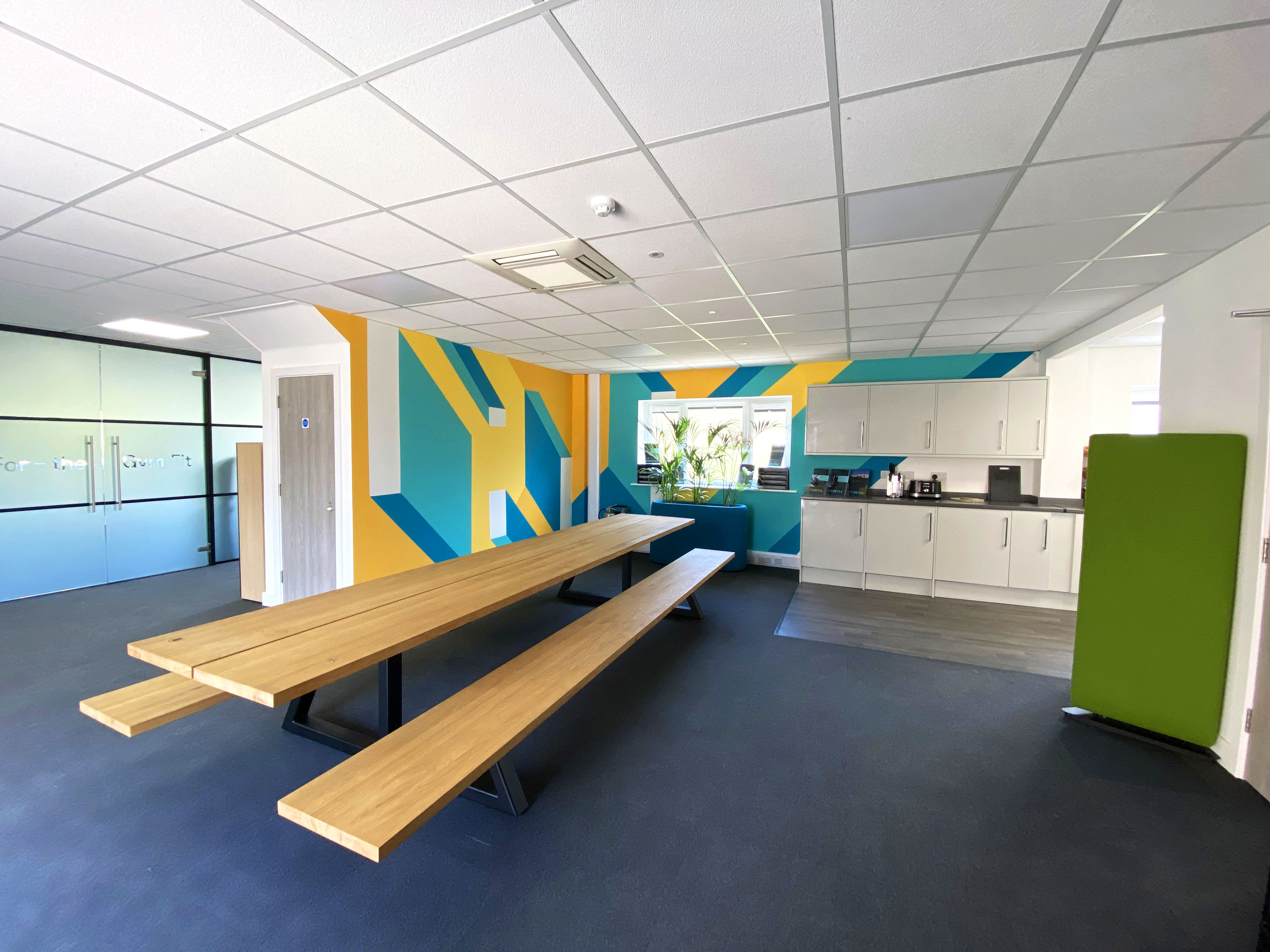 Final view of the hand-painted mural installed in FORTH's office, enhancing the workspace with dynamic visuals.