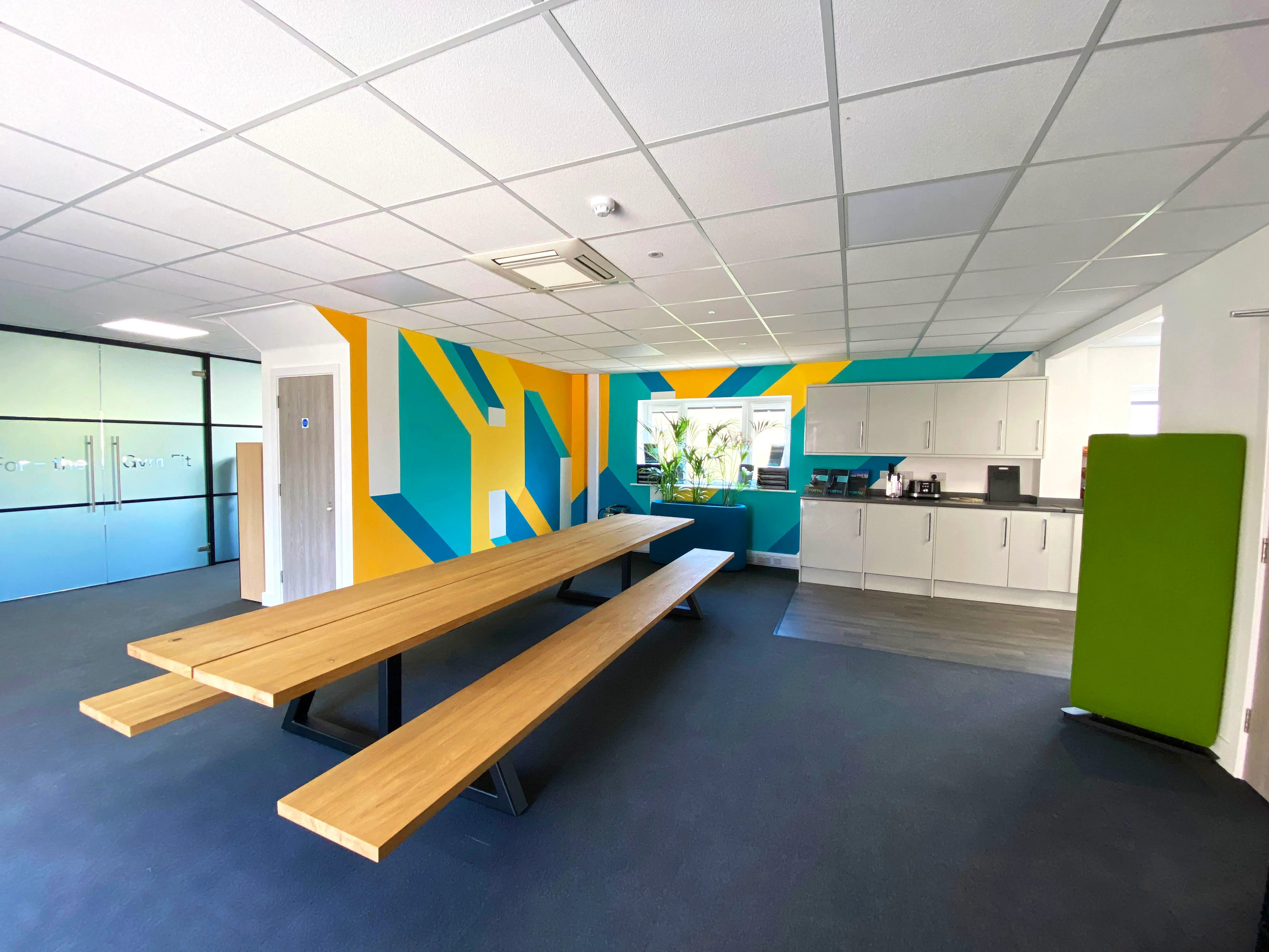 Final view of the hand-painted mural installed in FORTH's office, enhancing the workspace with dynamic visuals.