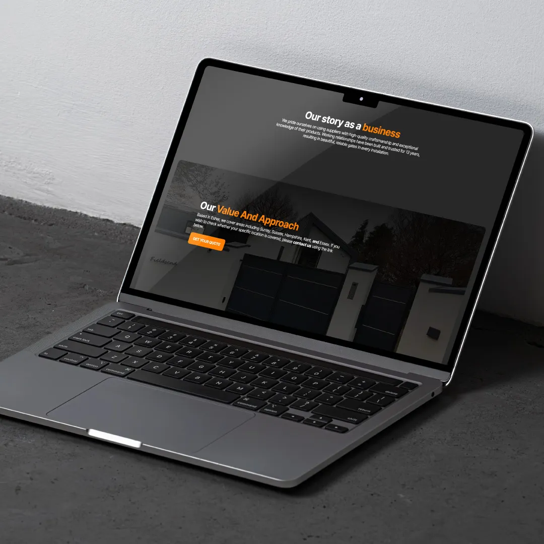 A laptop displaying a business website with text and a "Get Started" button on the screen.