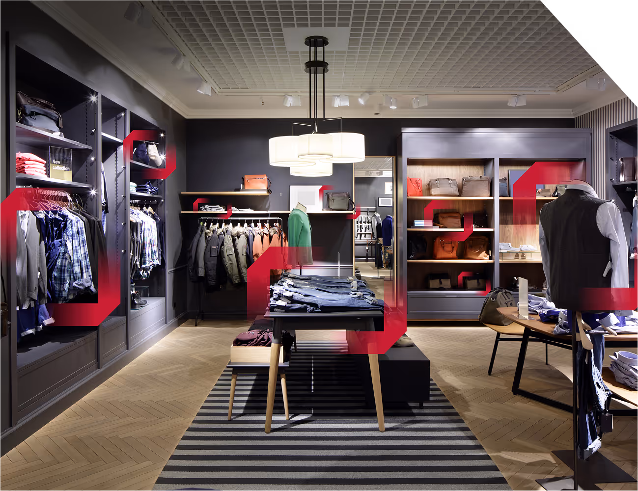 Clothing store with racks of shirts, jackets, and shelves with neatly folded jeans and bags.