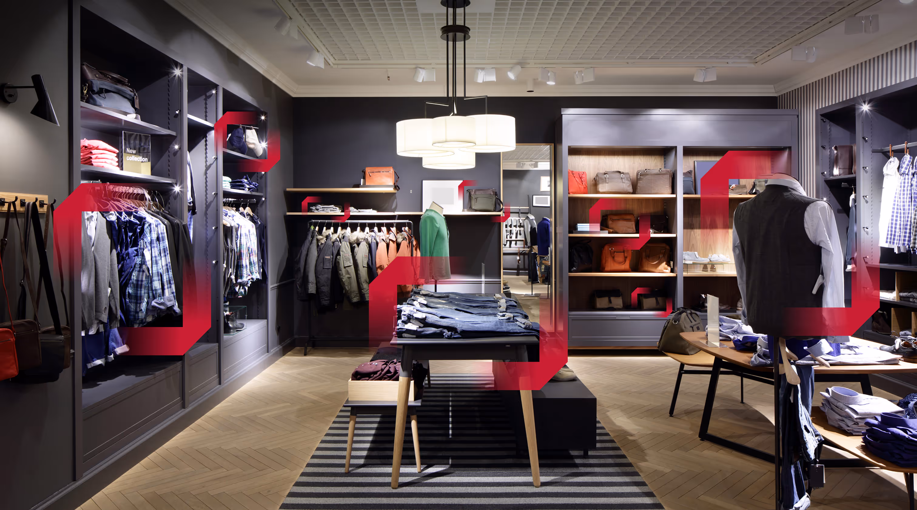 Clothing store interior with neatly arranged shirts, jackets, and bags on display racks and shelves.
