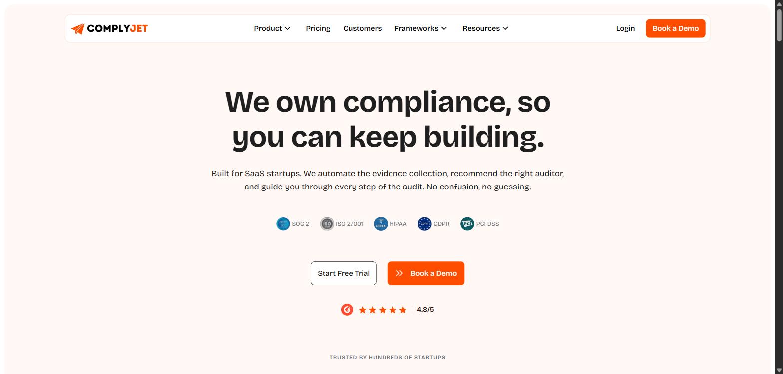 Screenshot of ComplyJet's homepage, showing its 'We own compliance, so you can keep building' headline.