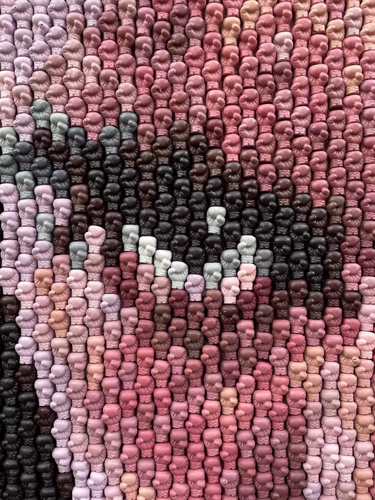 Detail of the Ali boxing-glove mosaic by Kevin Champeny showing individual hand-cast gloves