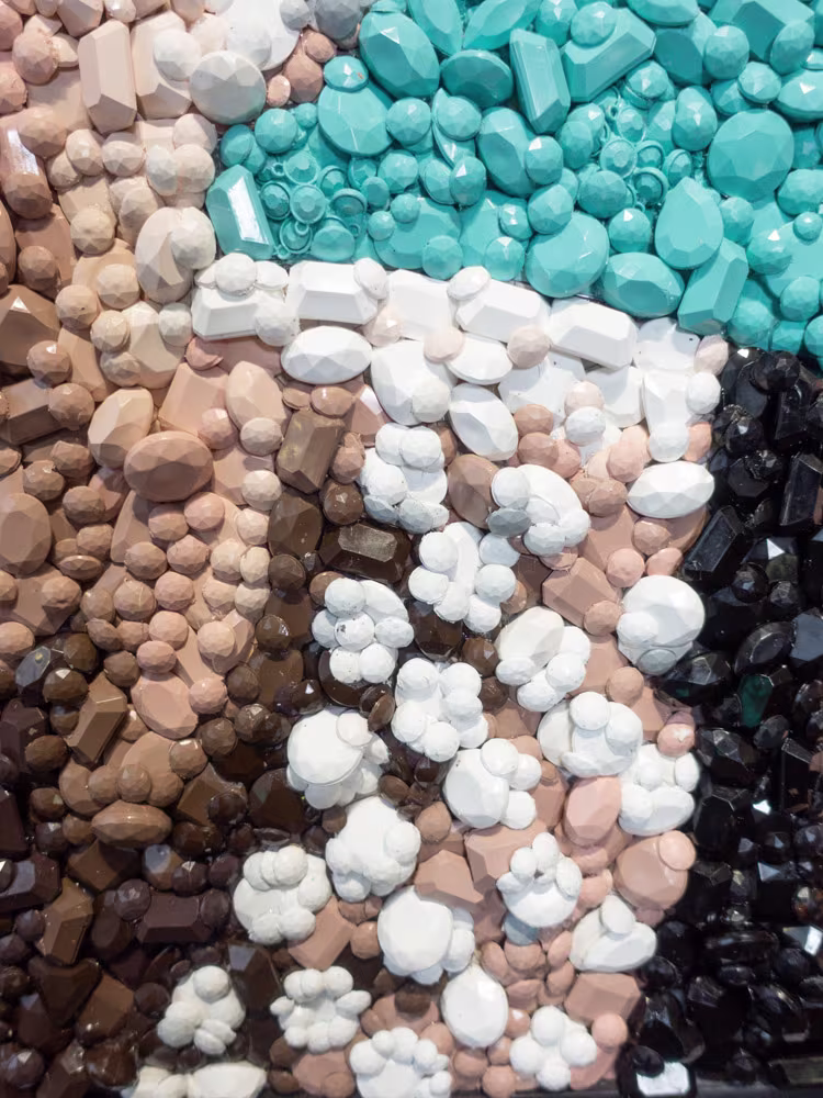 Detail of the Audrey Hepburn gemstone mosaic by Kevin Champeny showing individual hand-cast gemstones