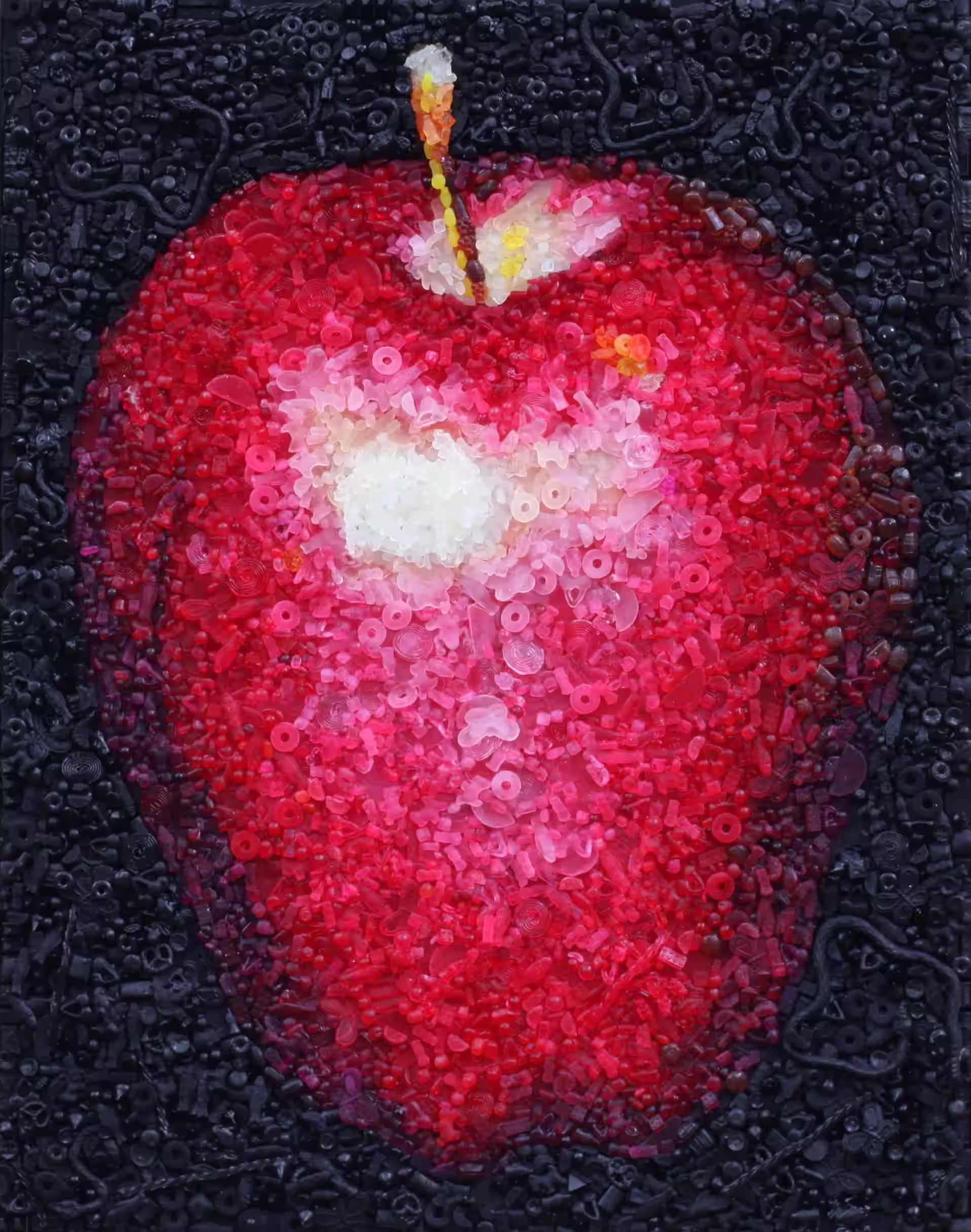 An Apple a Day candy mosaic by Kevin Champeny, a red apple built from 10,000 hand-cast pieces of candy