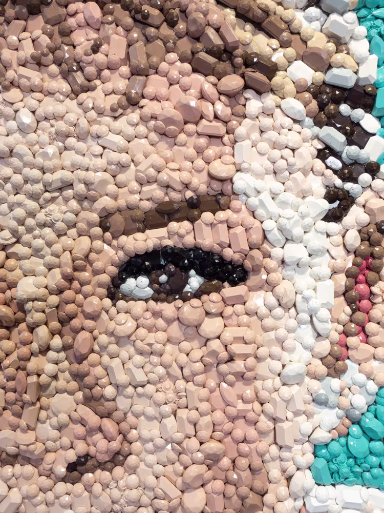 Detail of the Audrey Hepburn gemstone mosaic by Kevin Champeny showing individual hand-cast gemstones