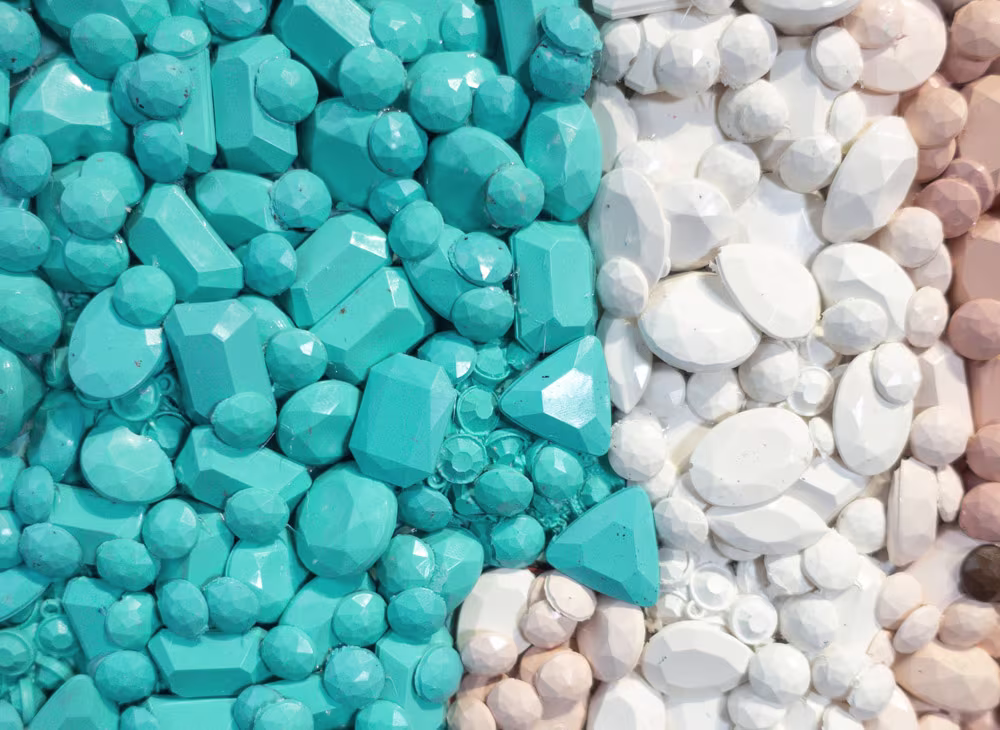 Detail of the Audrey Hepburn gemstone mosaic by Kevin Champeny showing individual hand-cast gemstones