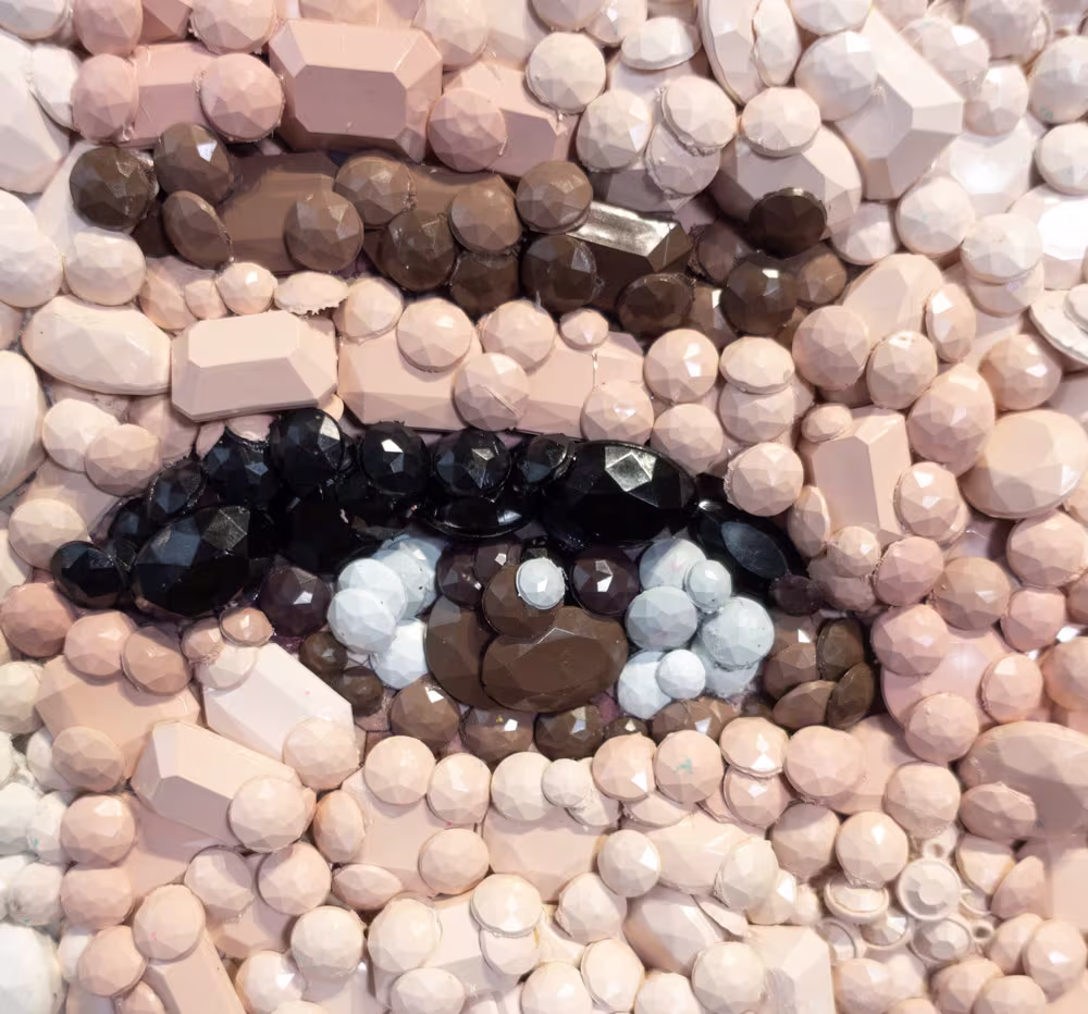 Detail of the Audrey Hepburn gemstone mosaic by Kevin Champeny showing individual hand-cast gemstones