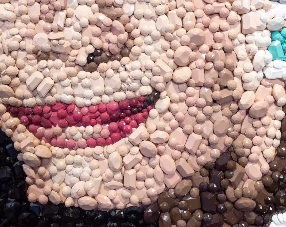 Detail of the Audrey Hepburn gemstone mosaic by Kevin Champeny showing individual hand-cast gemstones