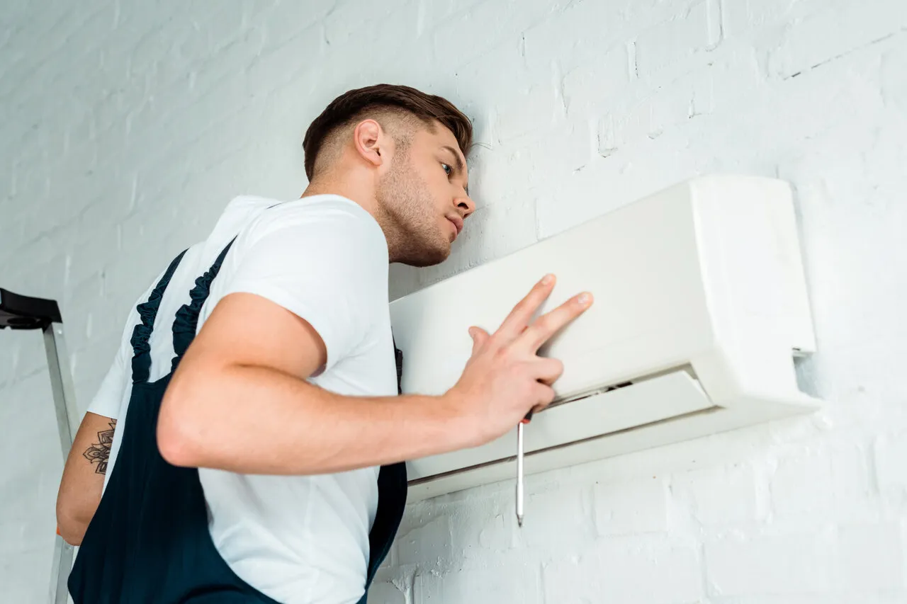 HVAC technician installing mini-split AC
