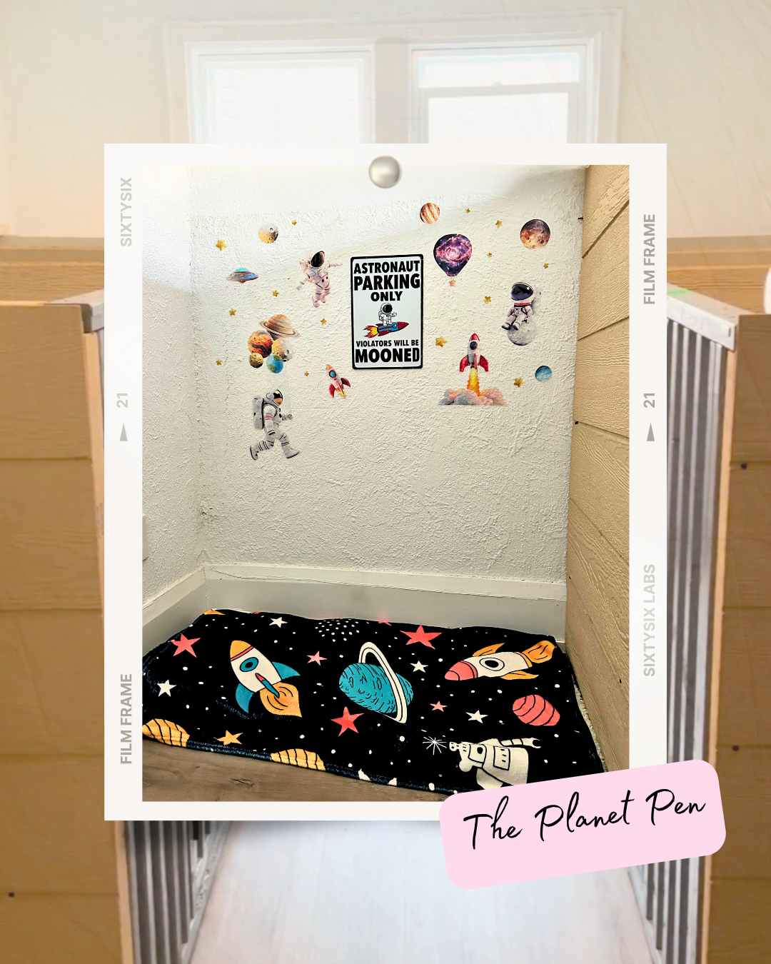 Small corner space decorated with astronaut, rocket, and planet wall stickers and a space-themed blanket on the floor.