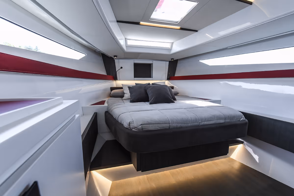 Fiart 43 Seawalker master cabin with large central bed and wraparound windows for a bright, elegant feel