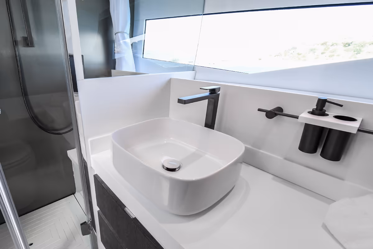 Fiart 43 Seawalker bathroom featuring modern basin and minimalist design with sea-view window