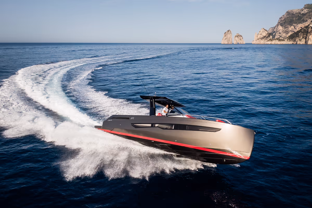 Fiart 43 Seawalker cruising at high speed near the coastline, showcasing its sleek design and stability at sea