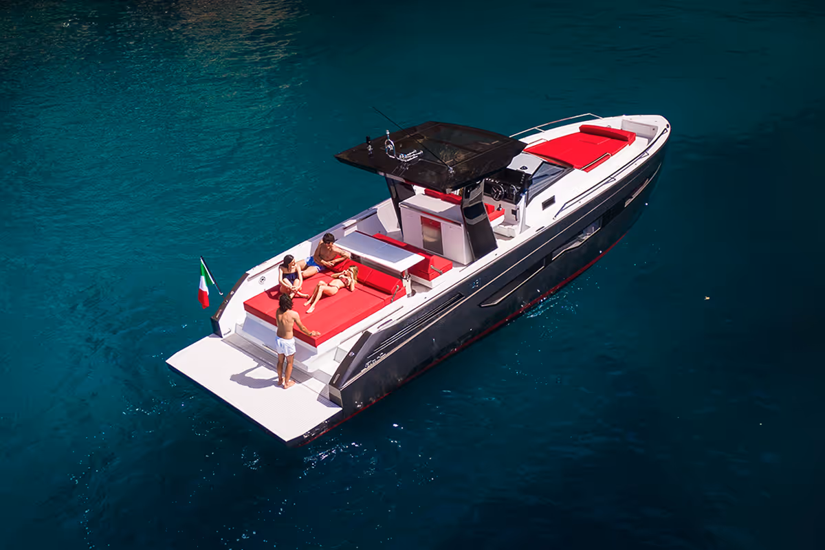 Fiart 43 Seawalker anchored with guests lounging in the cockpit area and easy access to the sea via the bathing platform