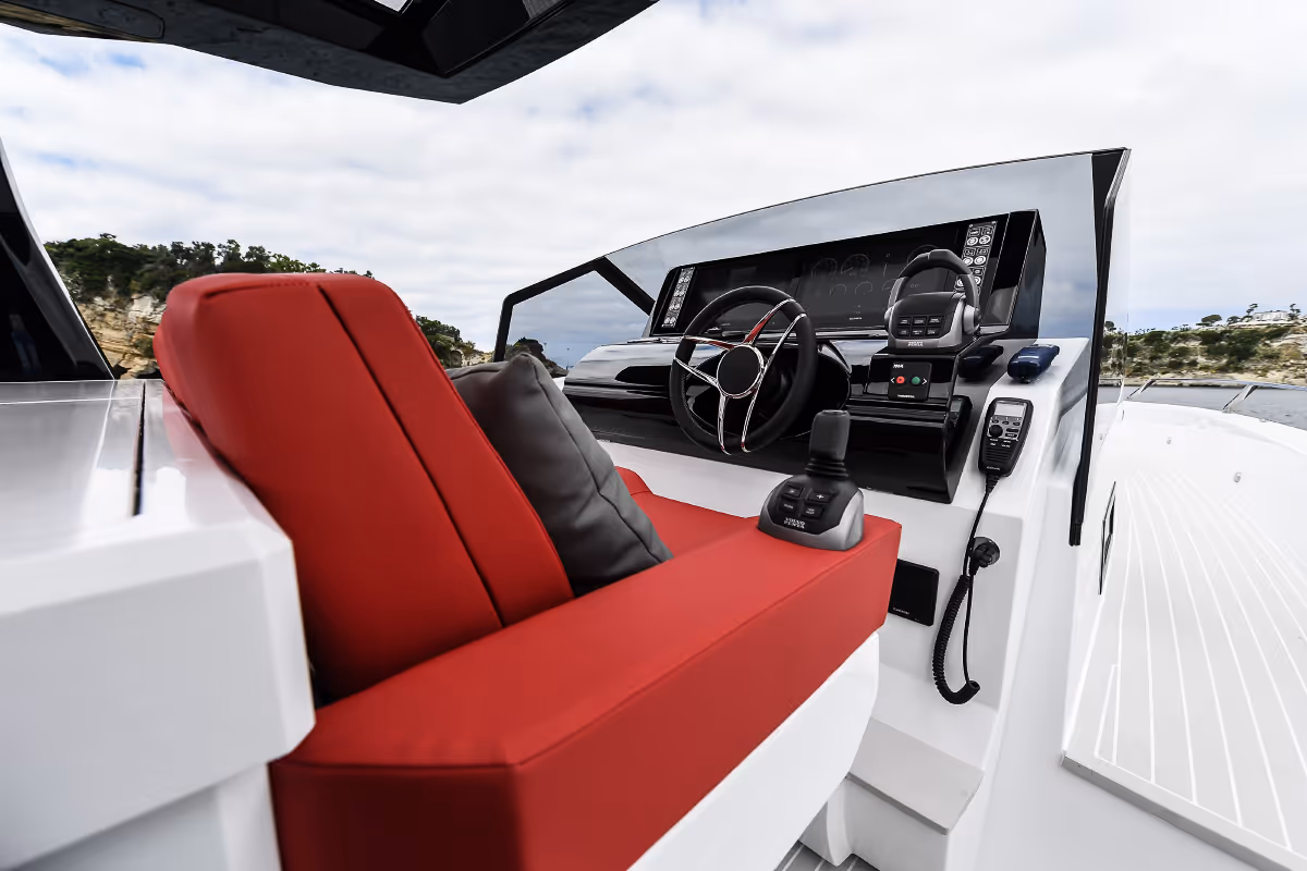 Fiart 43 Seawalker helm station with premium red seating and intuitive controls for a smooth navigation experience.