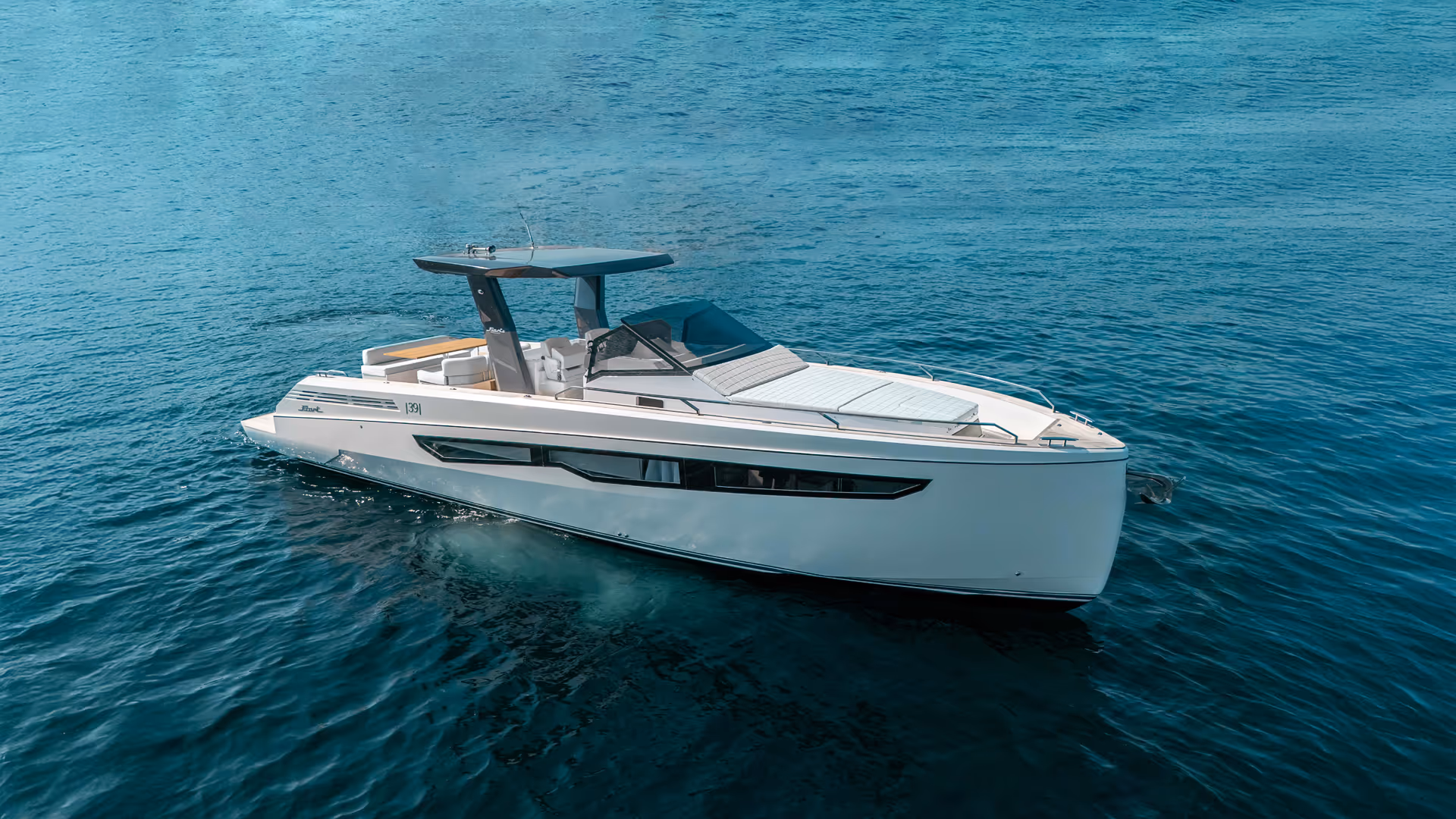Exterior view of a Fiart Seawalker 39 charter motor yacht cruising seamlessly on open waters.