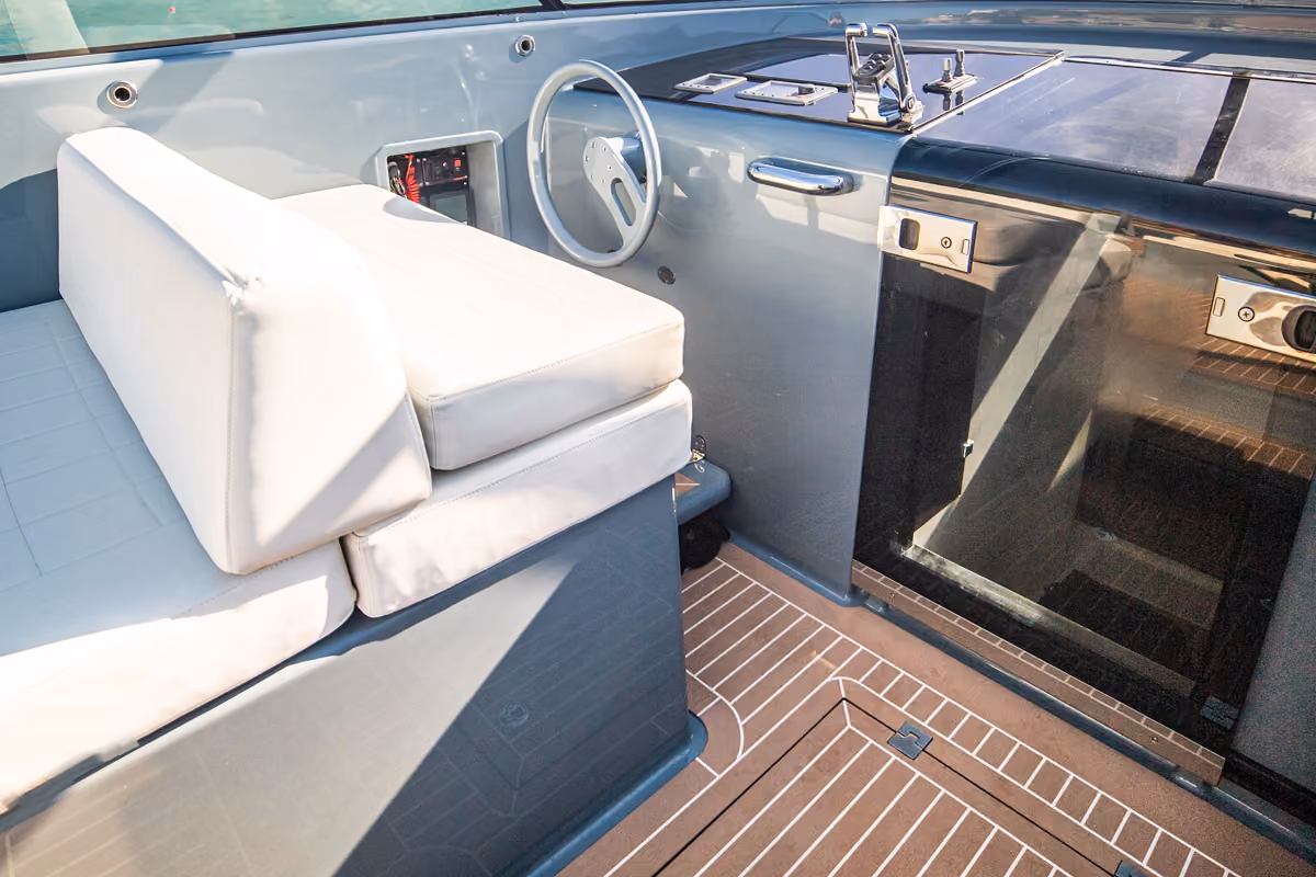 Interior view of the helm station on VanDutch 40 charter, combining functionality with modern design.
