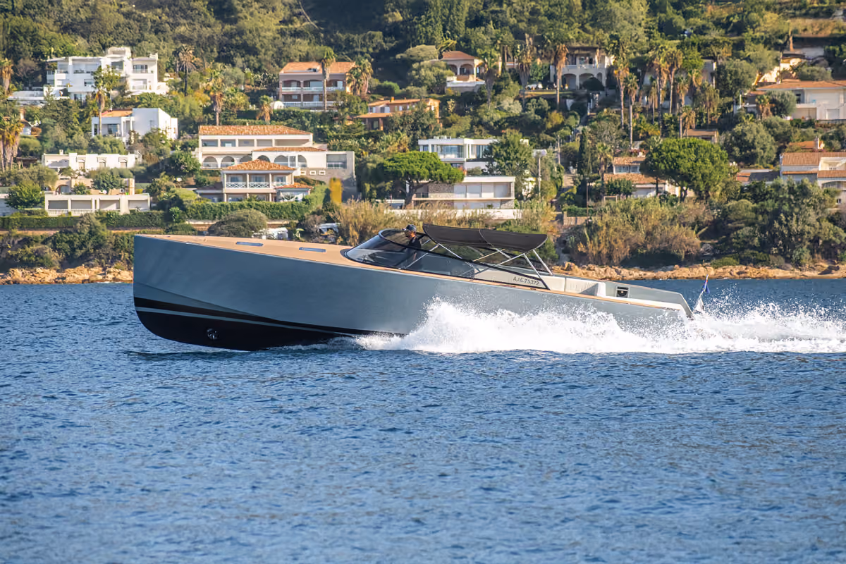 The VanDutch 40 charter cruising on the water, showcasing dynamic performance and elegant design.
