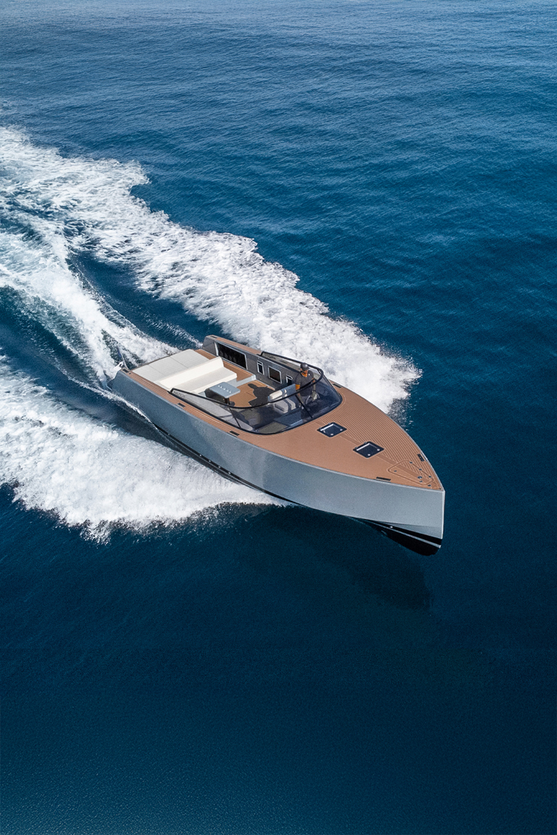 Exterior view of the VanDutch 40 charter, showcasing sleek lines and open deck. at sunset with warm golden light during charter cruising