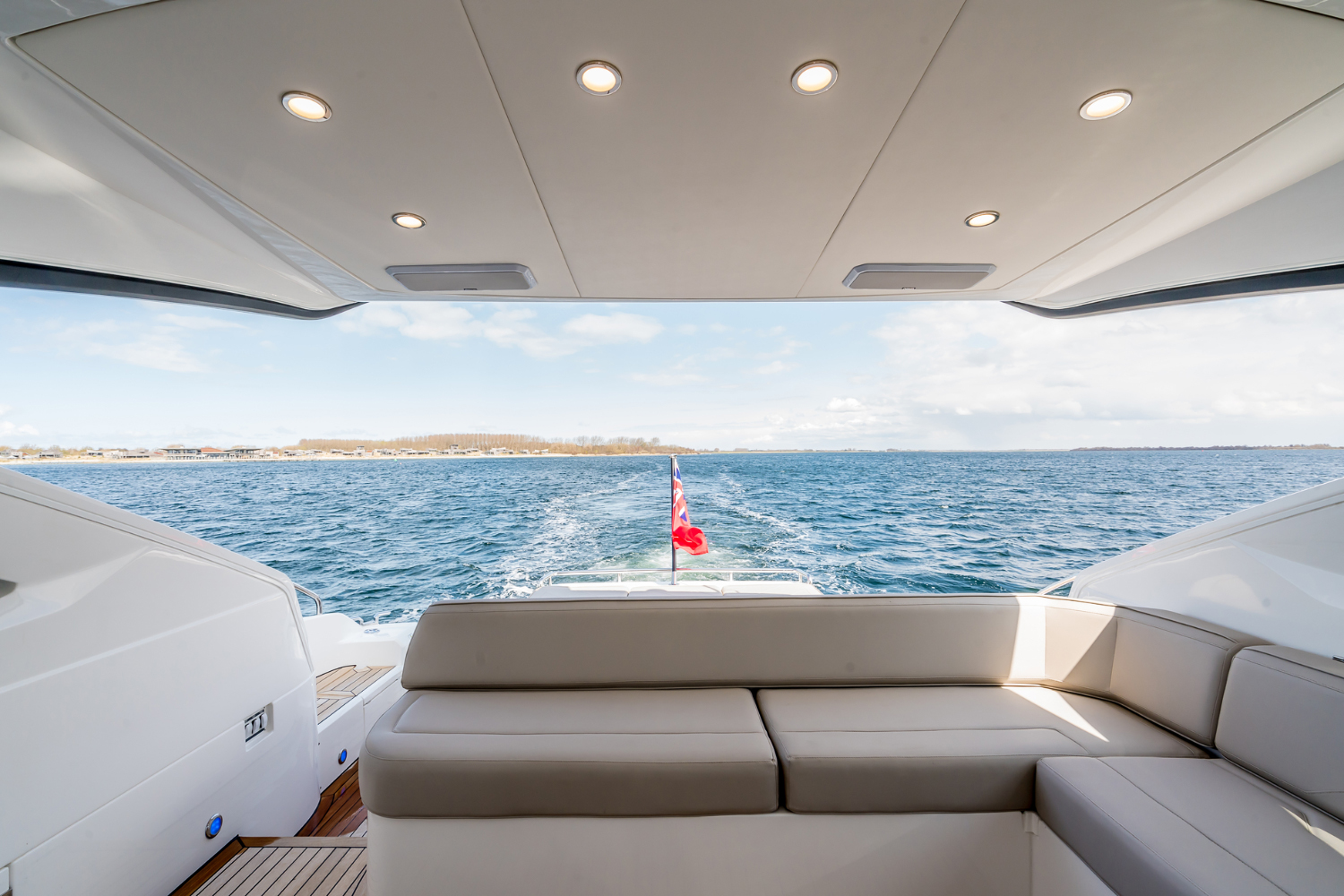 Comfortable seating area on the Targa 50 Open charter, featuring views of the open water and surroundings.