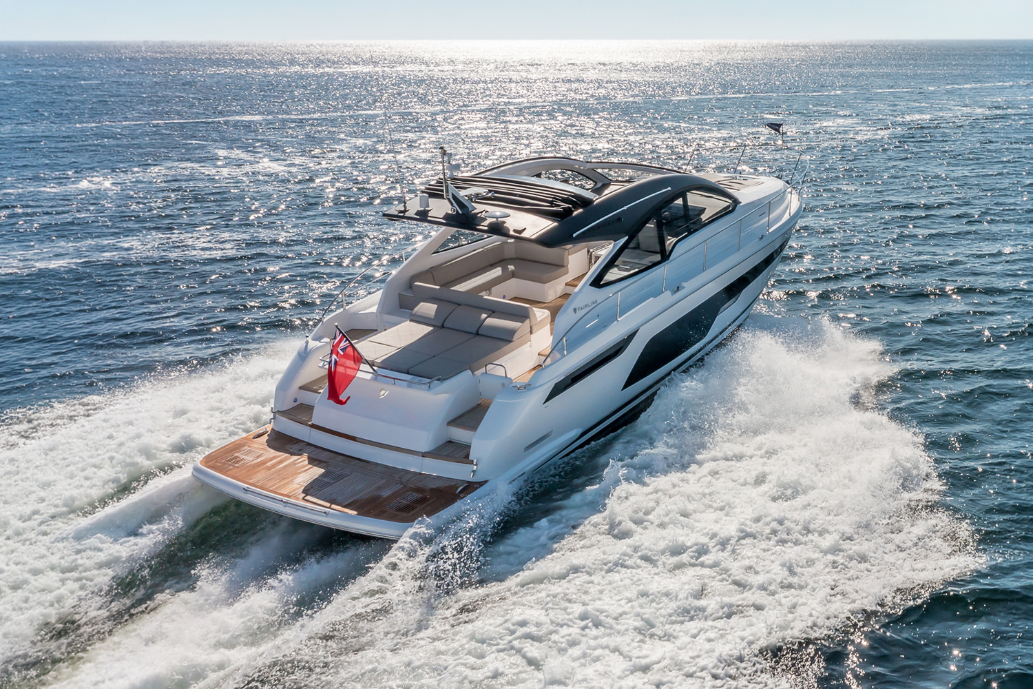 A rear view of the Targa 50 Open charter as it glides through shimmering waters, perfect for relaxation.