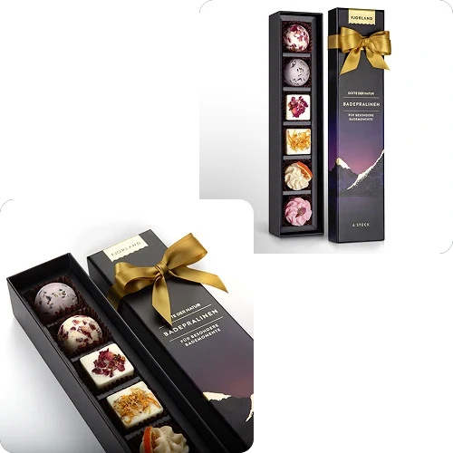 Studio-Produktfoto von edler Schokoladenverpackung mit goldener Schleife – professionelle Produktfotografie für Amazon und Online-Shops.